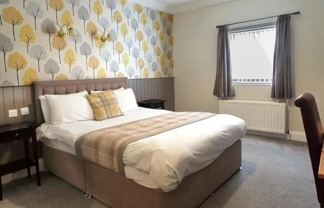 Bed in The Marine Hotel