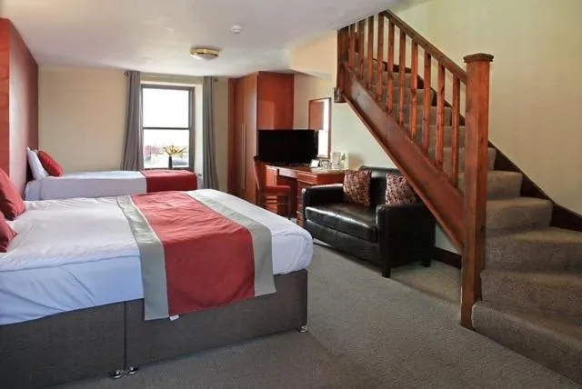 Bed in The Marine Hotel