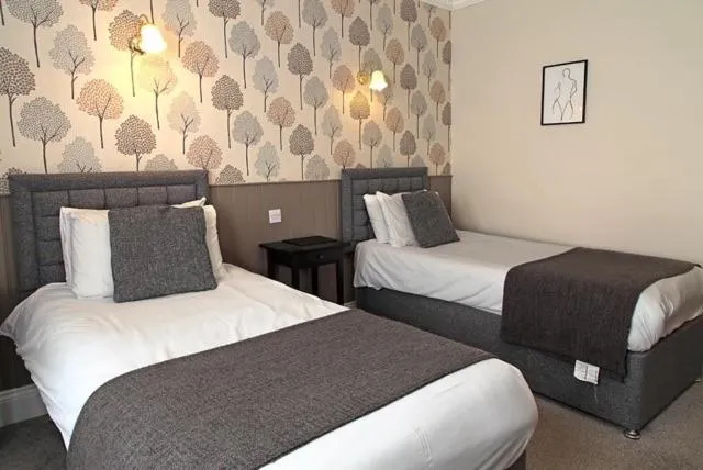 Bed in The Marine Hotel