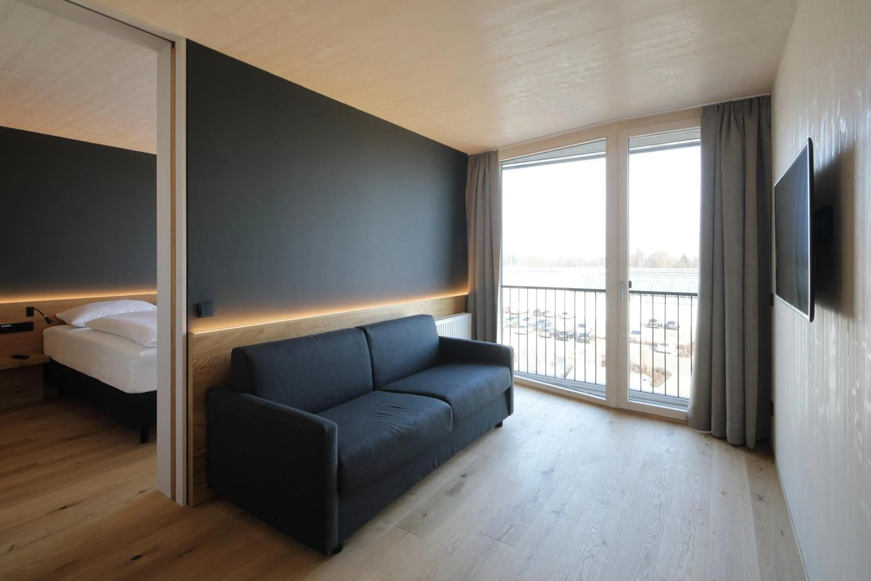 Living room, Bed in 2ND HOME HOTEL