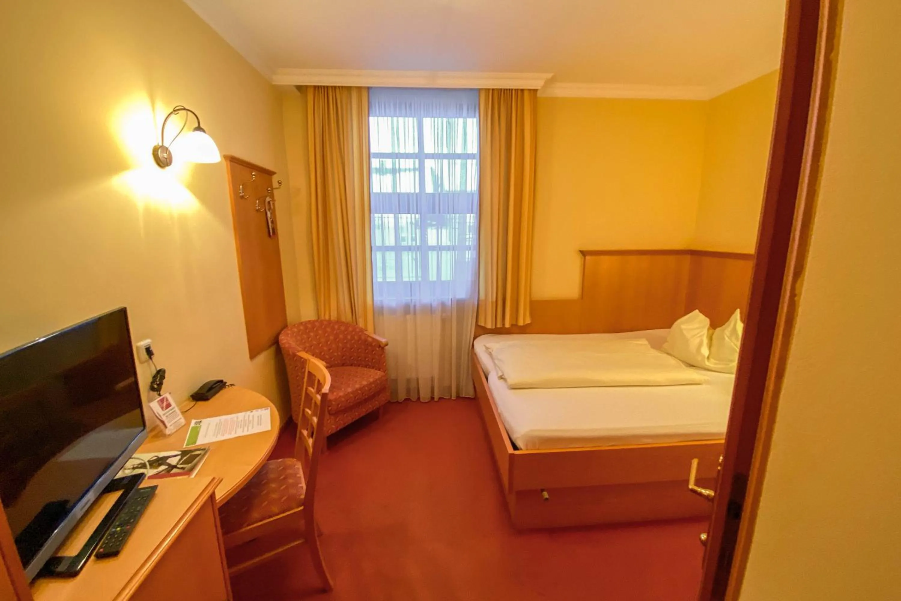 Photo of the whole room, Bed in Landhotel Gasthof Bauböck