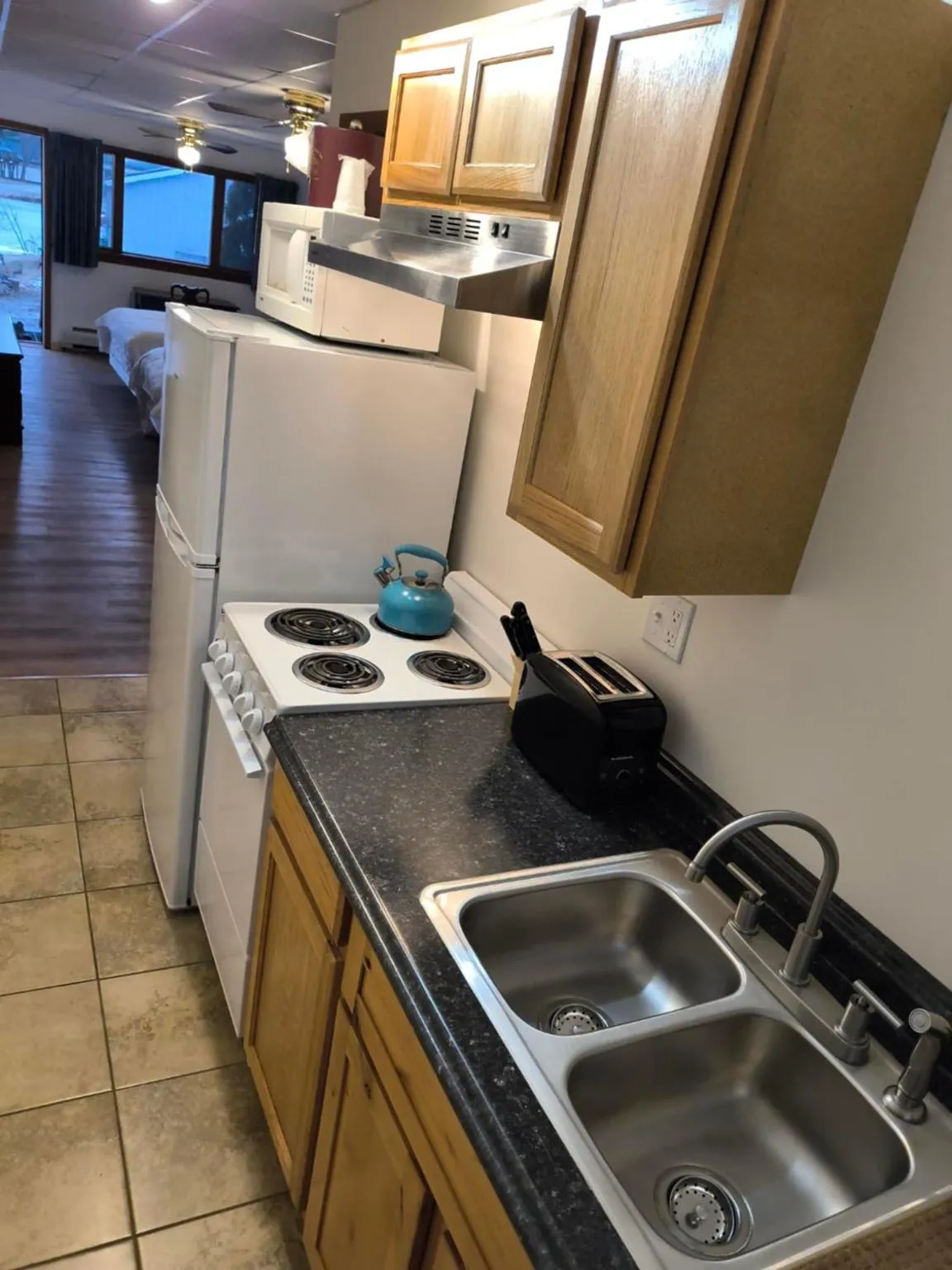 Kitchen or kitchenette in Sara Placid Inn & Suites