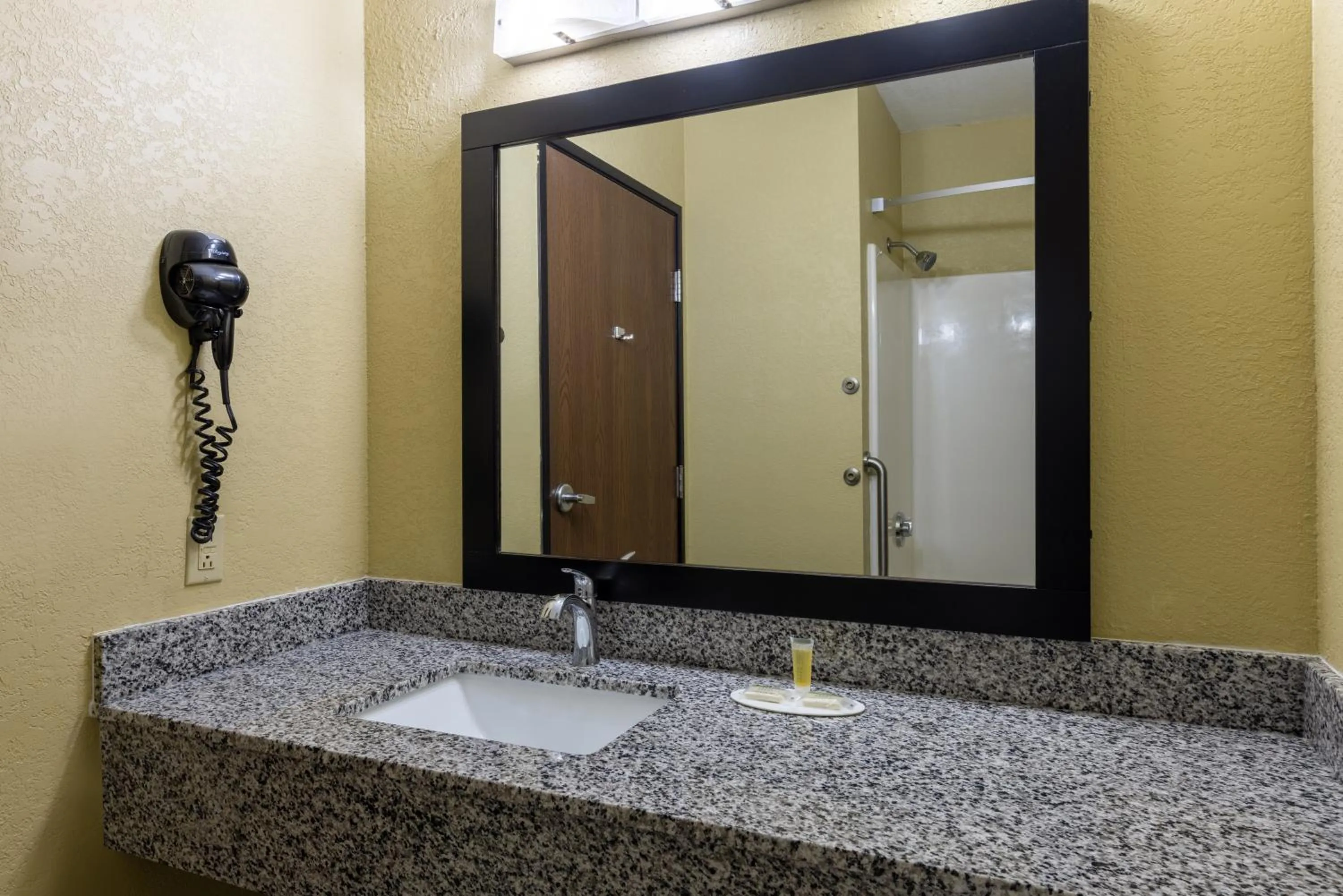 Bathroom in Super 8 by Wyndham Nixa/Springfield Area