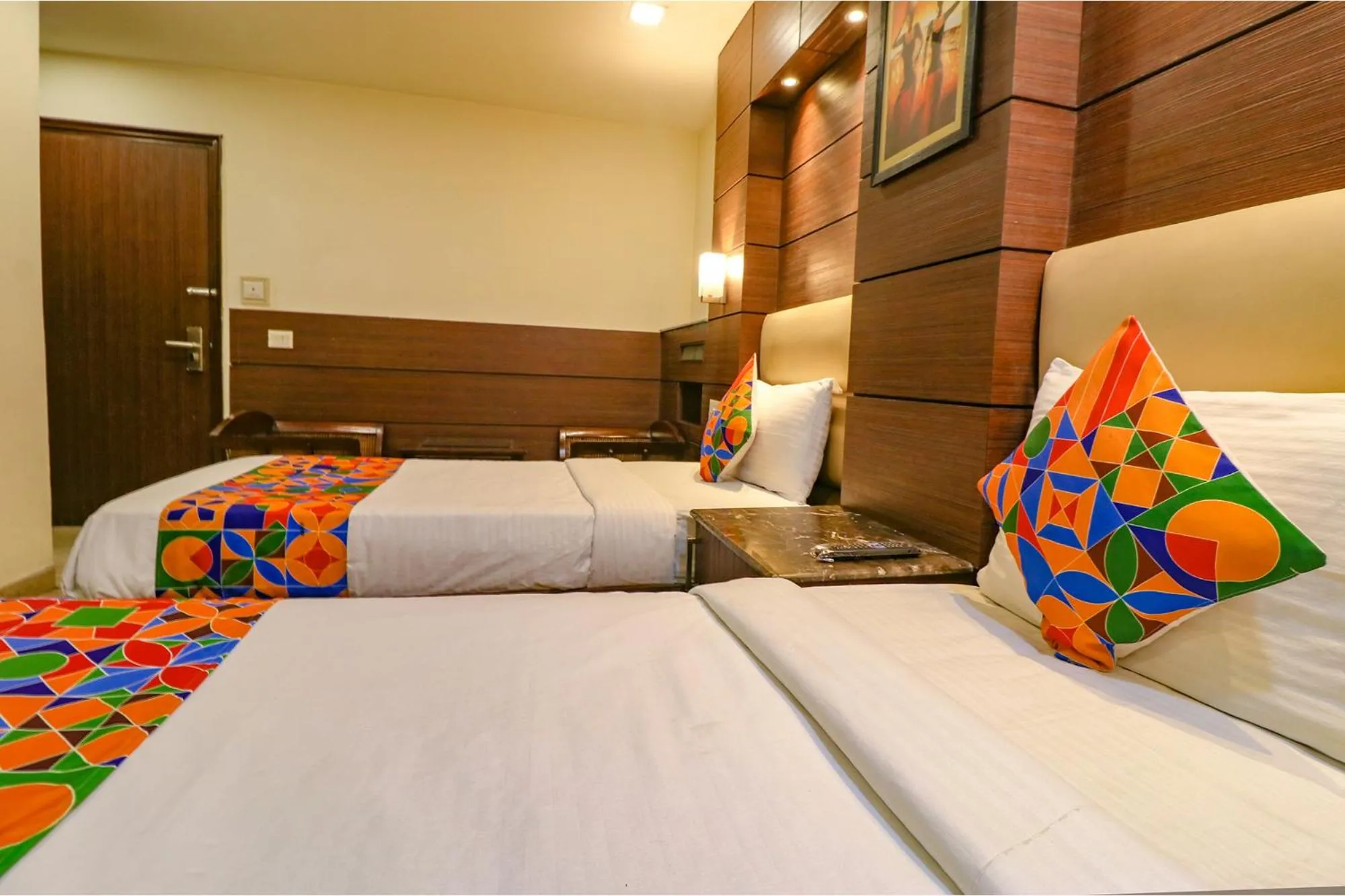 Bed in FabHotel Admire Suites