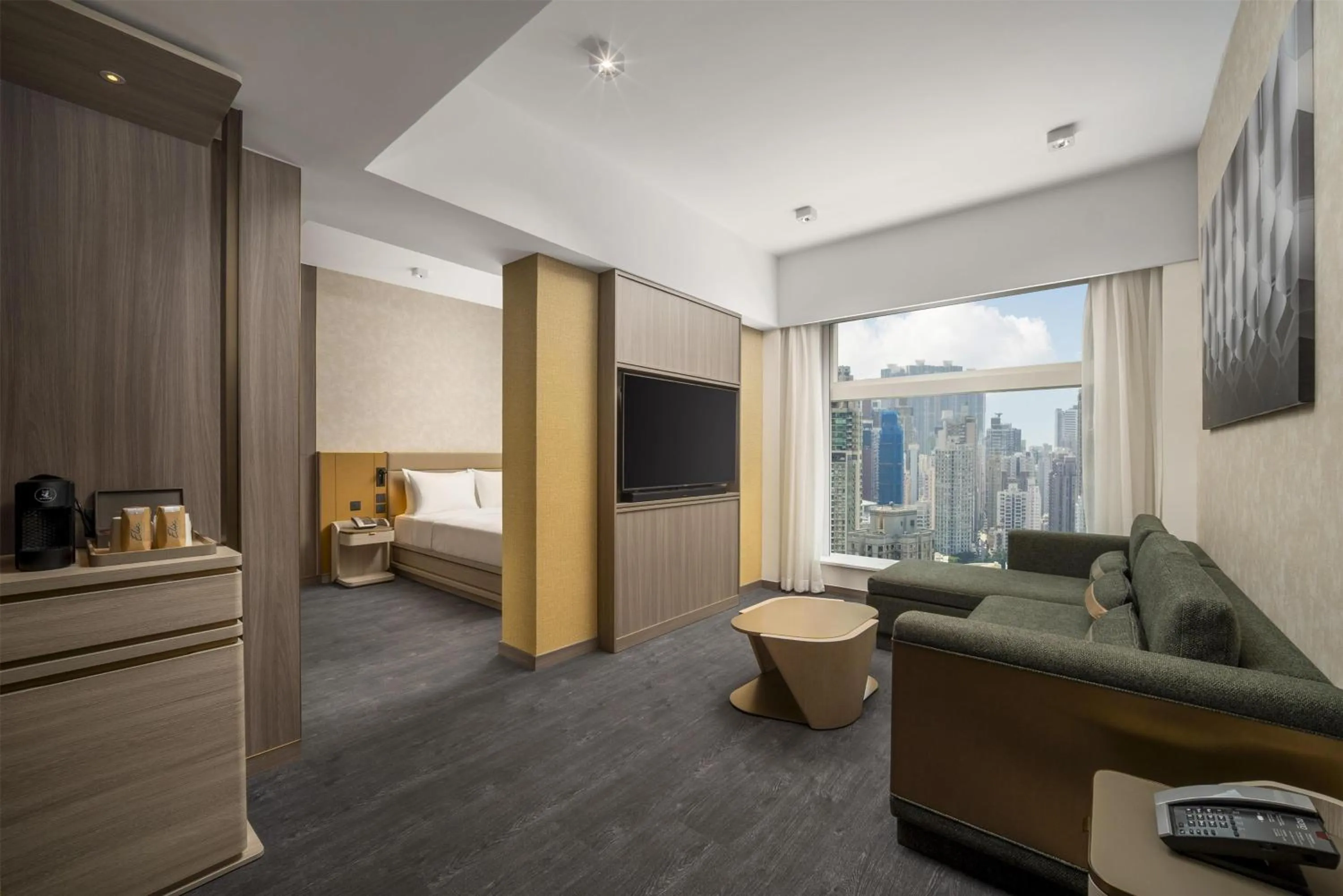 Living room, Bed in Motto by Hilton Hong Kong Soho
