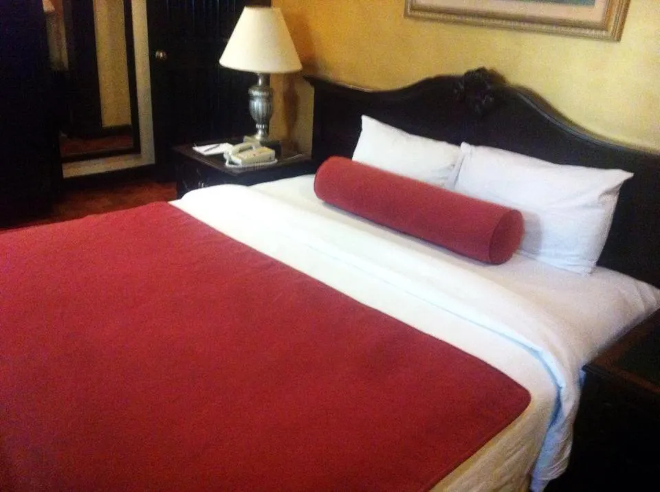 Bed in Lourdes Family Suites Makati powered by Cocotel