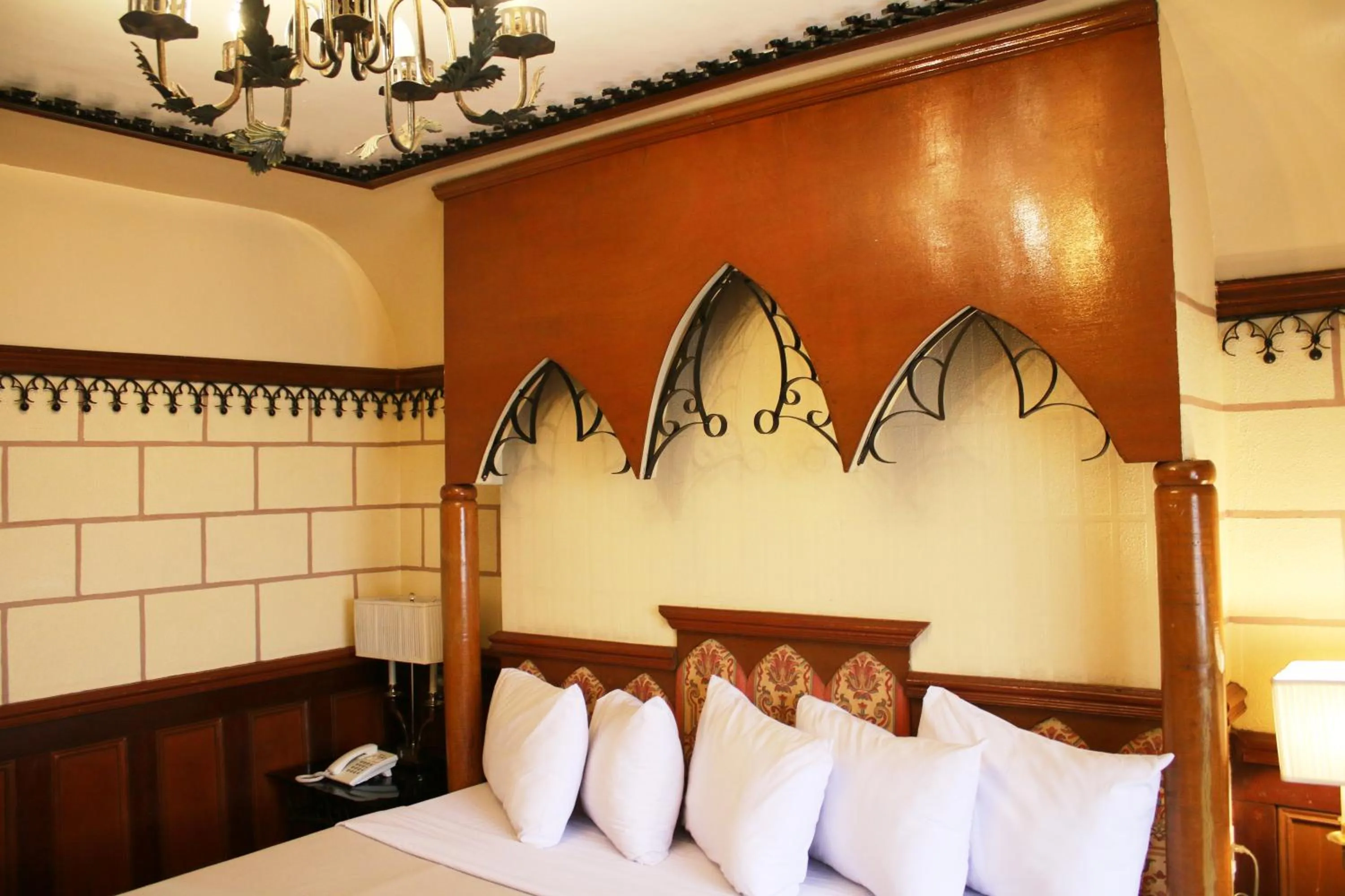 Bed in Camelot Hotel Quezon City powered by Cocotel