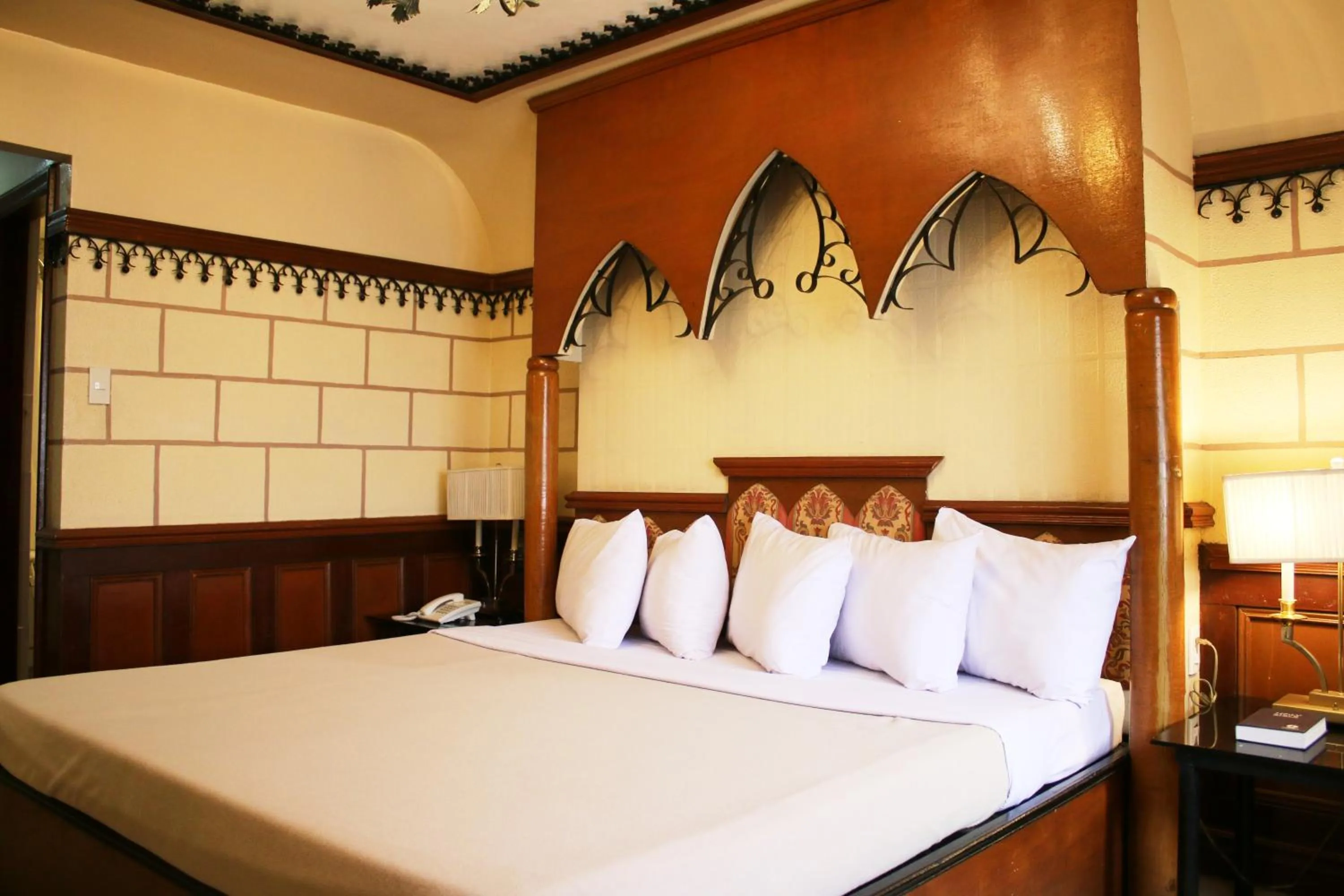 Bed in Camelot Hotel Quezon City powered by Cocotel