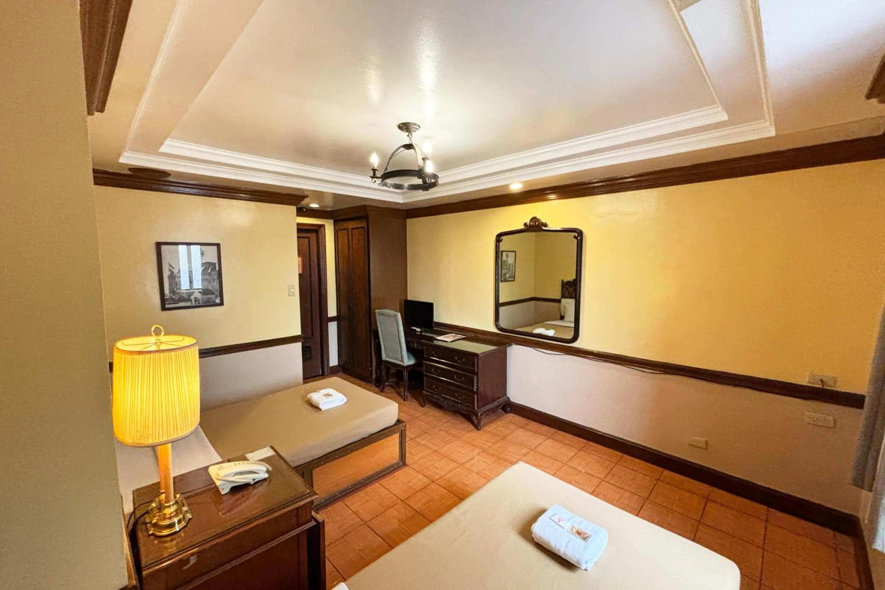 Bed in Camelot Hotel Quezon City powered by Cocotel