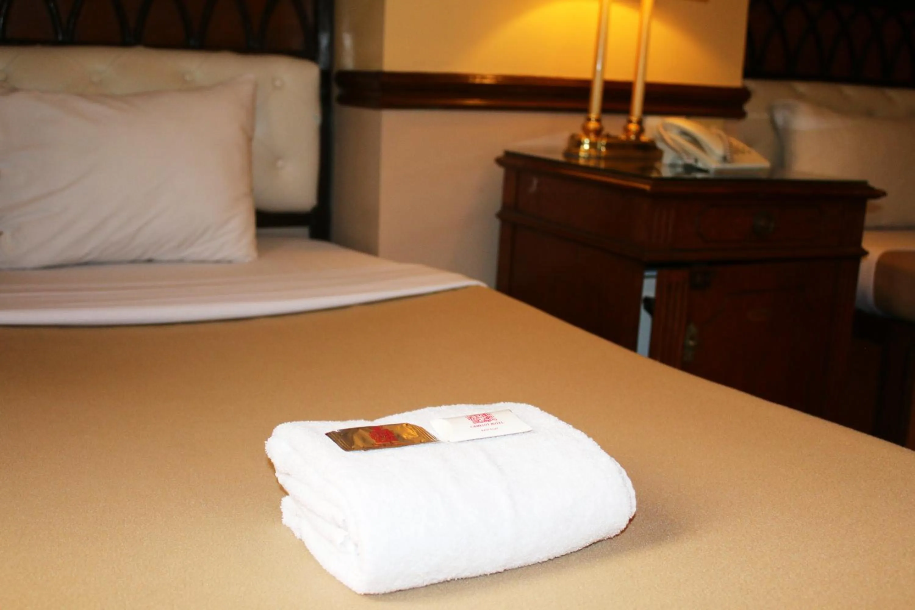 Bed in Camelot Hotel Quezon City powered by Cocotel