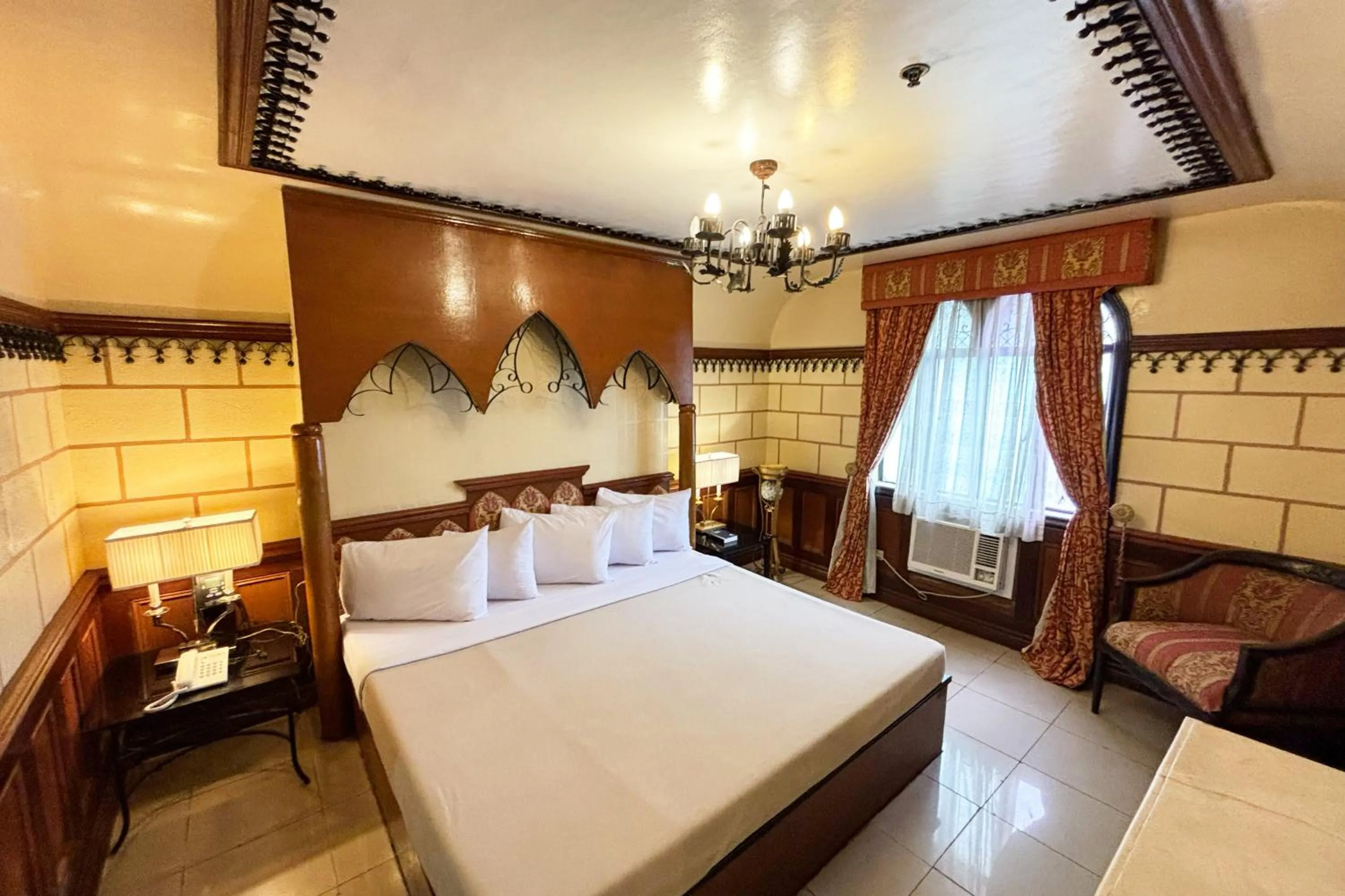 Bed in Camelot Hotel Quezon City powered by Cocotel