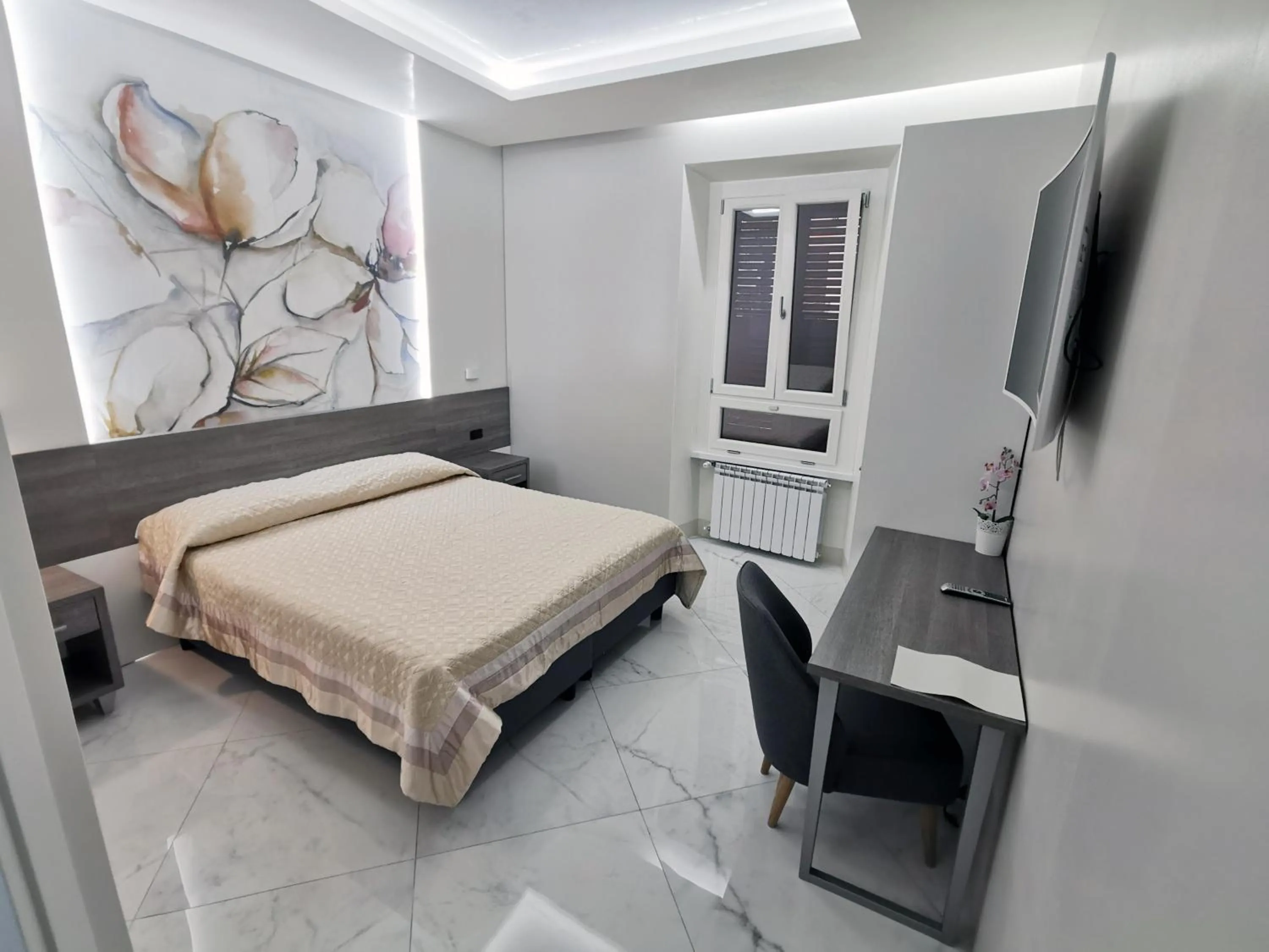 Bed in Hotel Valentino Palace