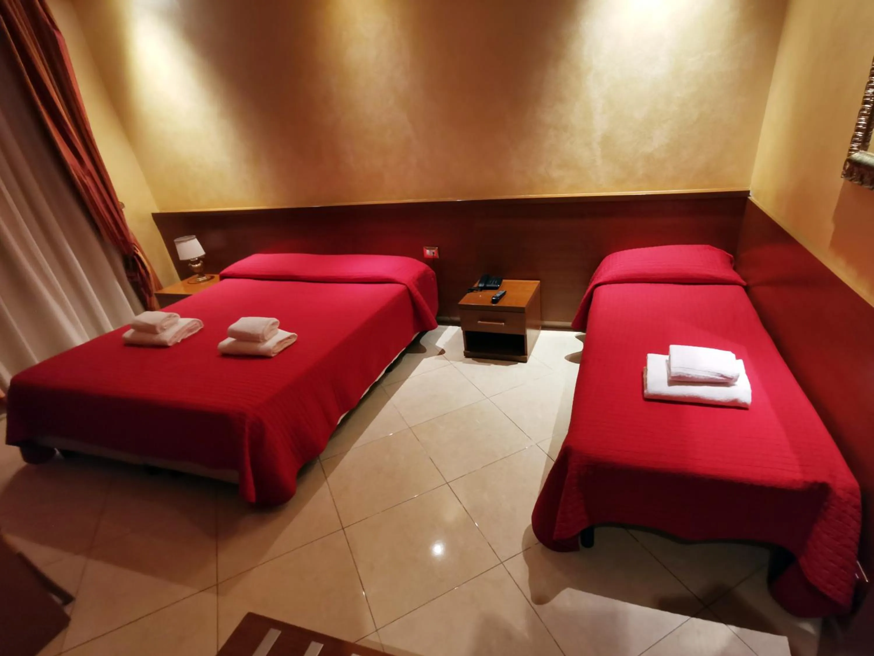 Bed in Hotel Valentino Palace