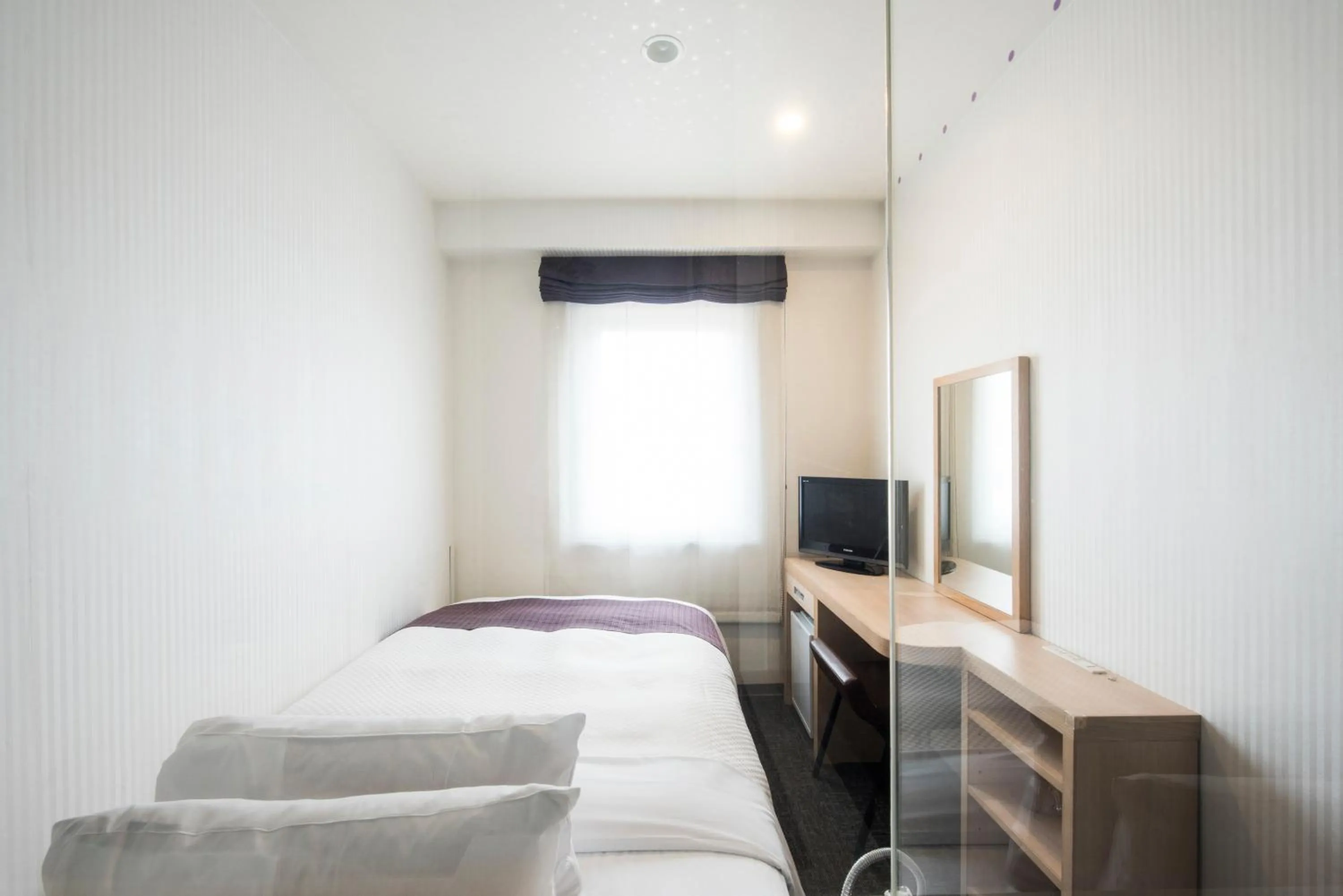 Photo of the whole room, Bed in Nagasaki Bus Terminal Hotel