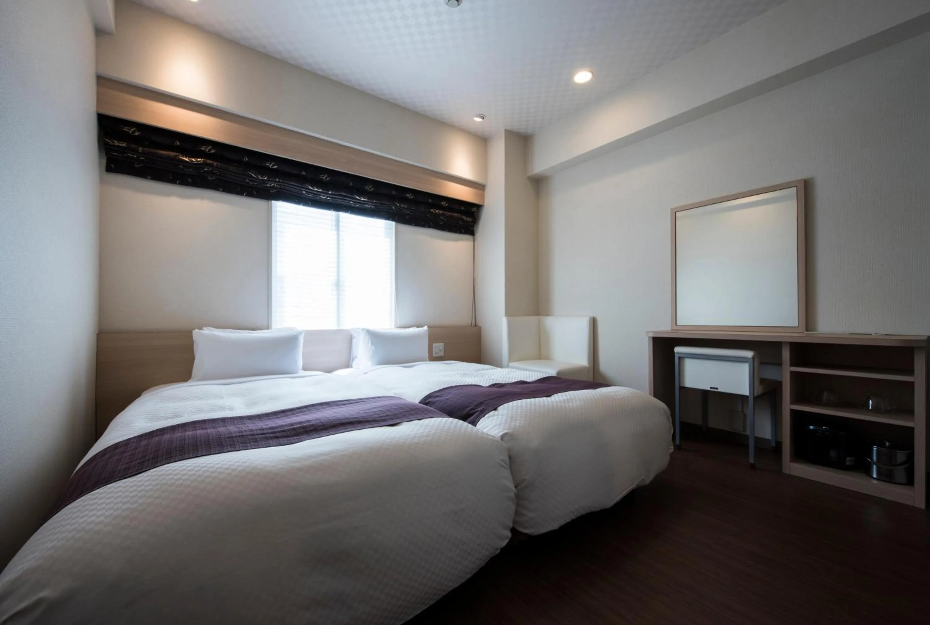 Photo of the whole room, Bed in Nagasaki Bus Terminal Hotel