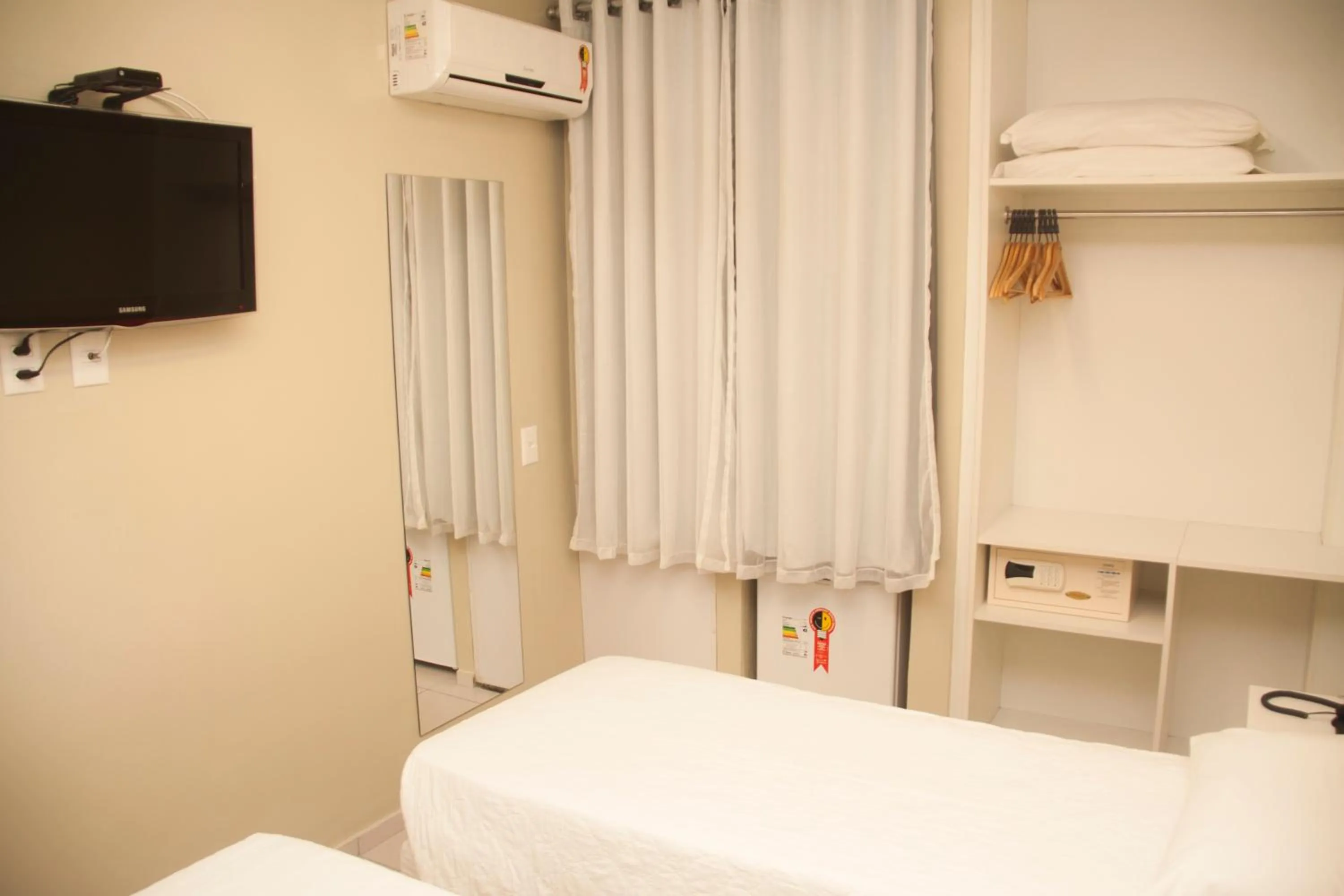 Bed in Hotel Três Caravelas