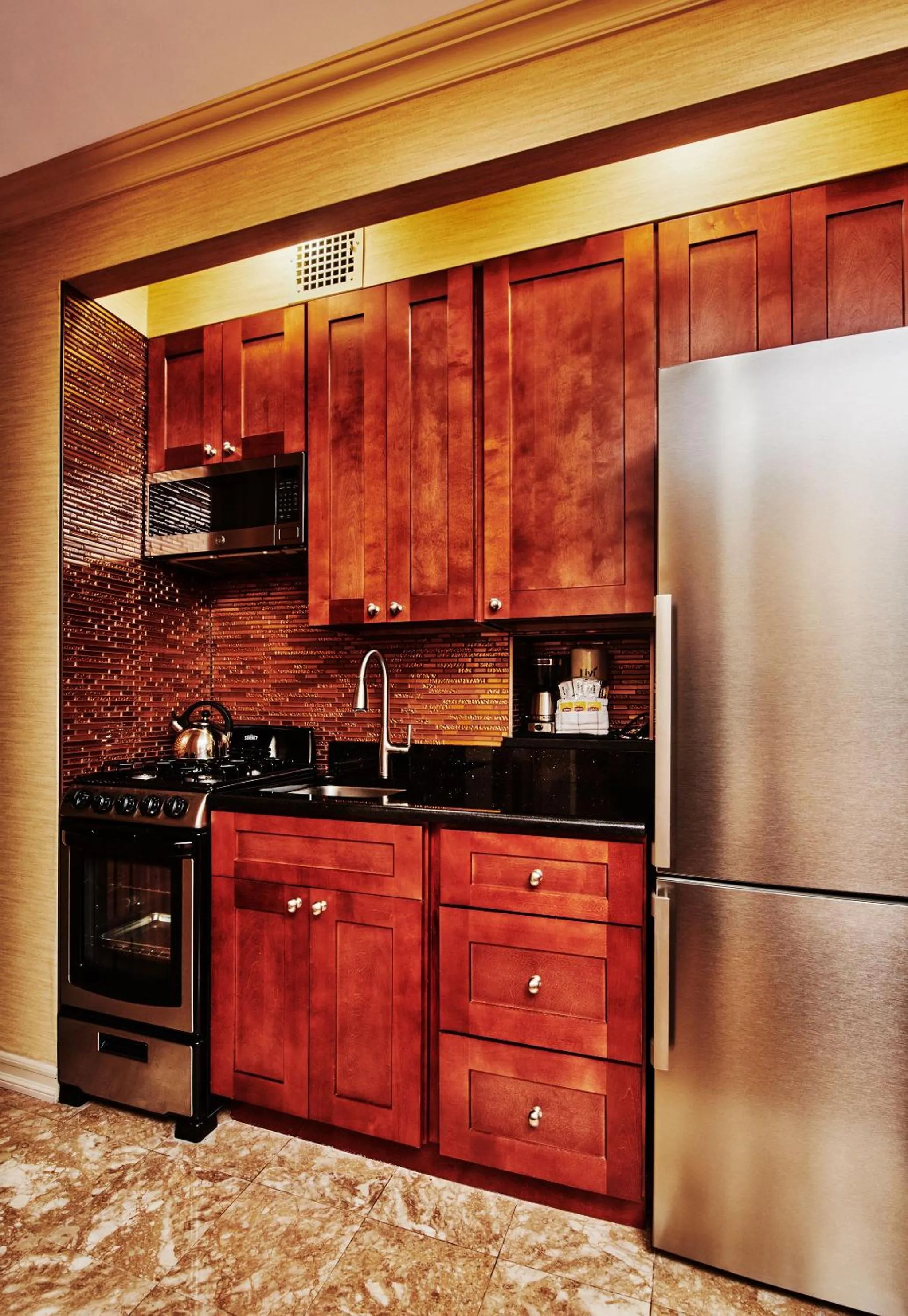Kitchen or kitchenette in Radio City Apartments