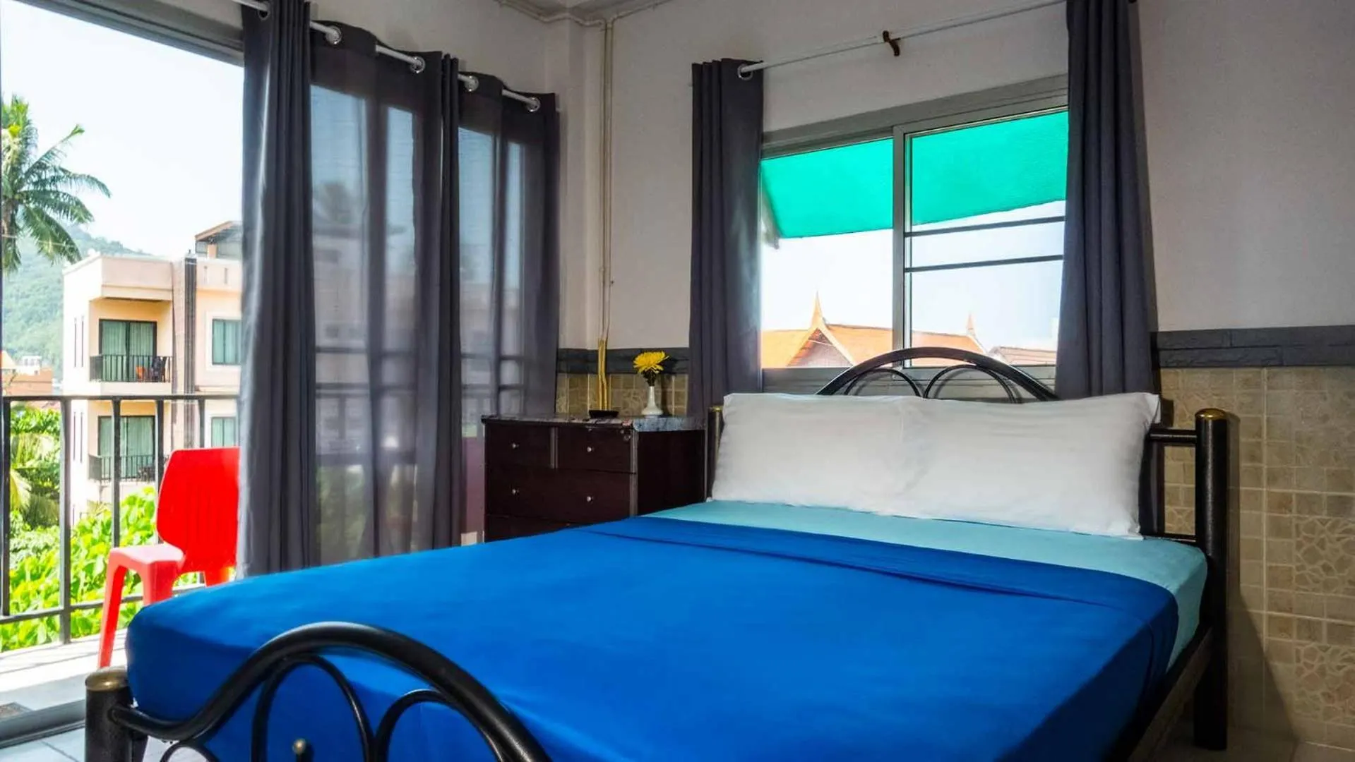 Bed in Sabina Guesthouse Kamala