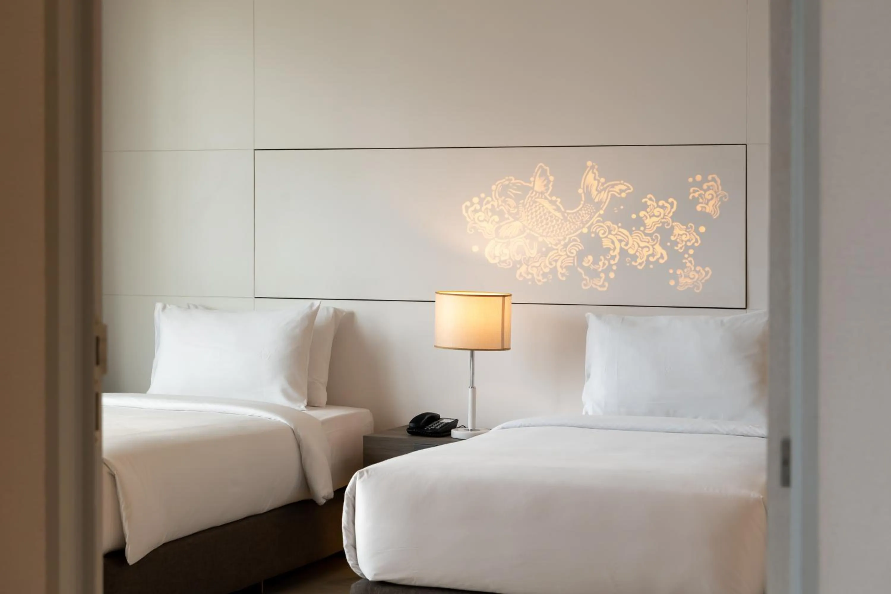 Bed in Jasmine 59 Hotel