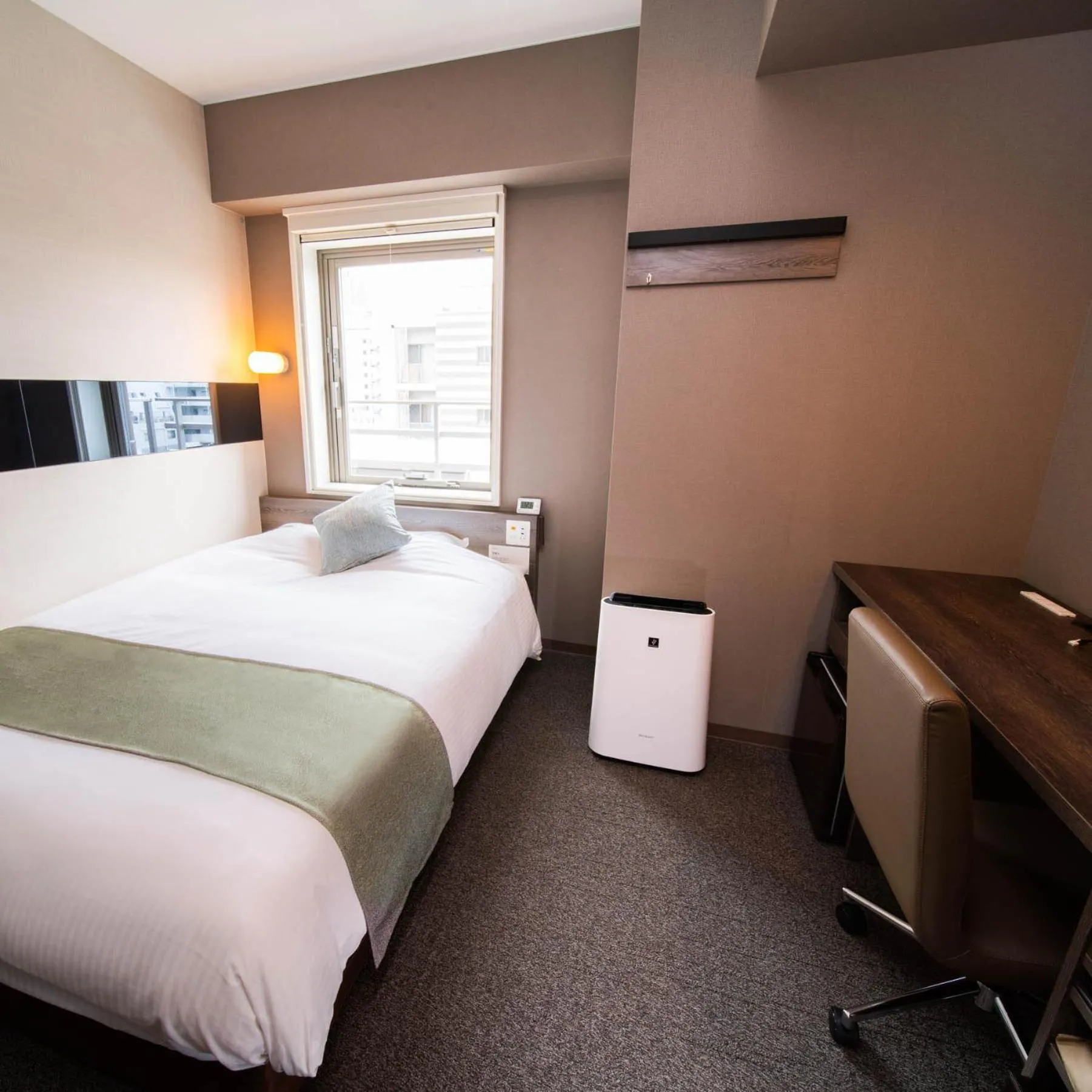 Bed in Super Hotel Premier Ginza