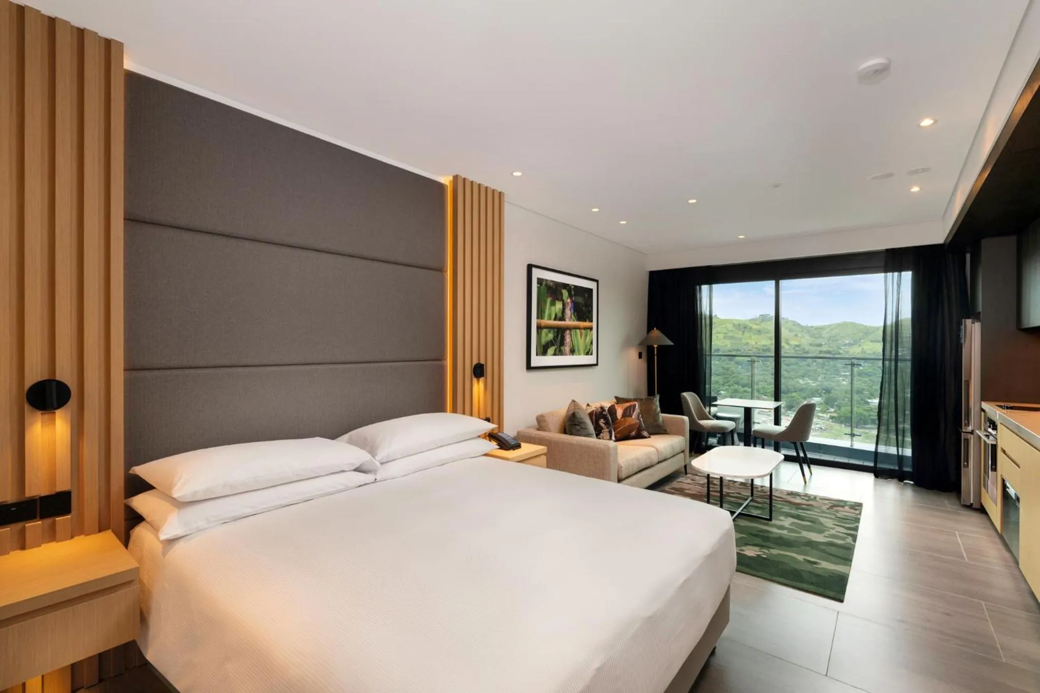 Living room, Bed in Hilton Port Moresby Hotel & Residences