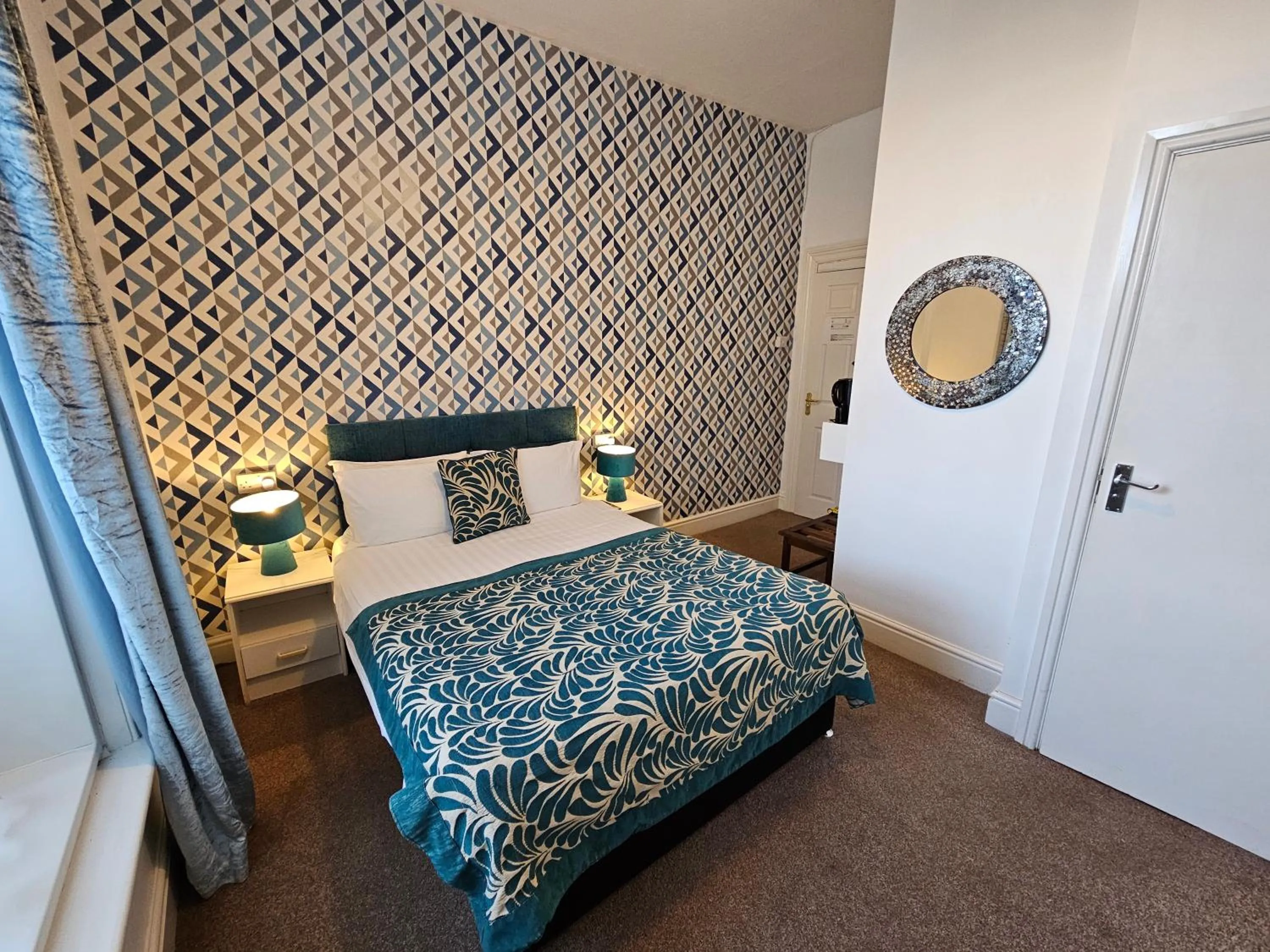 Bed in Rivelyn Hotel Bar & Restaurant