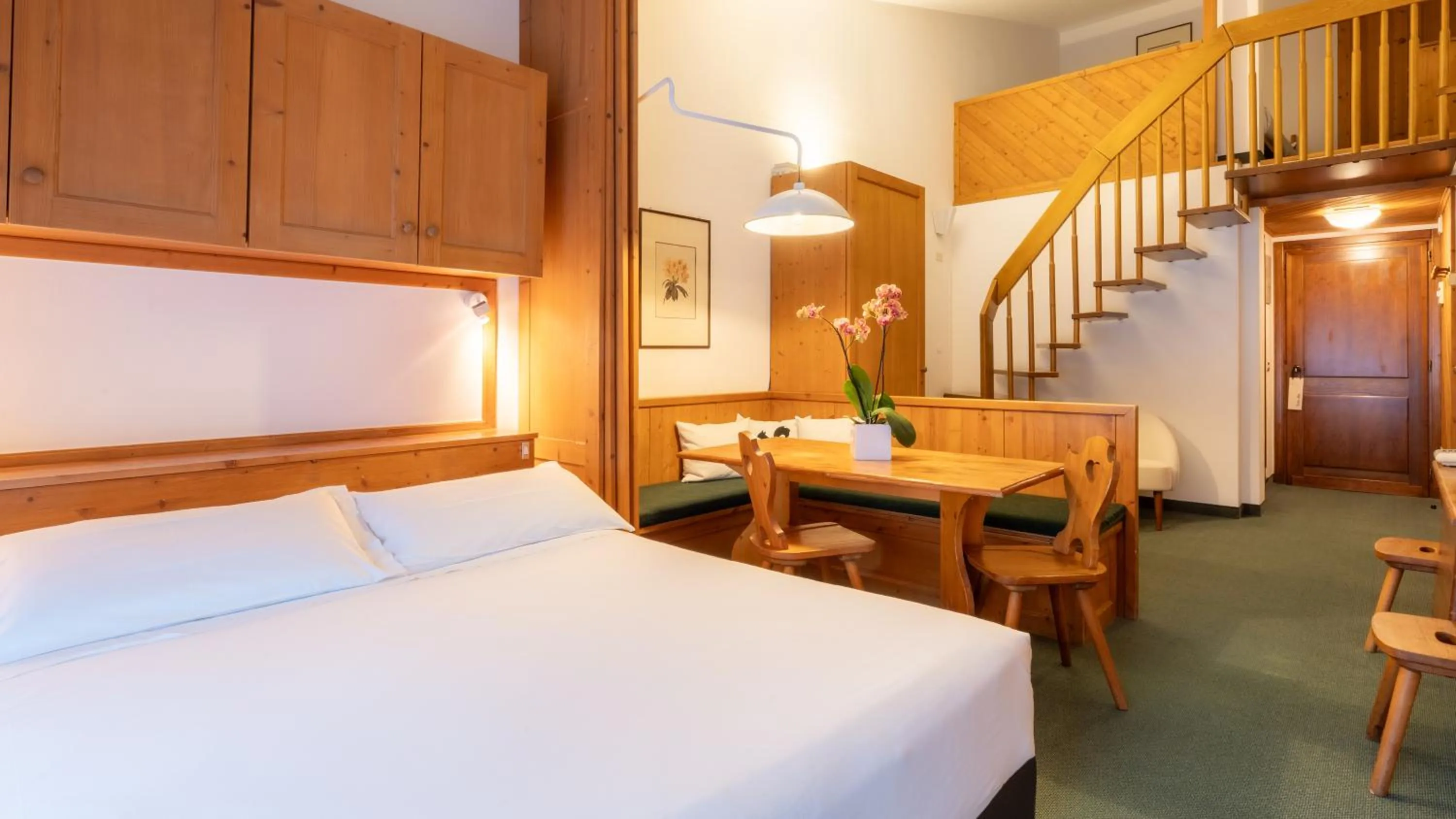 Bed in Hotel Cristallino d'Ampezzo