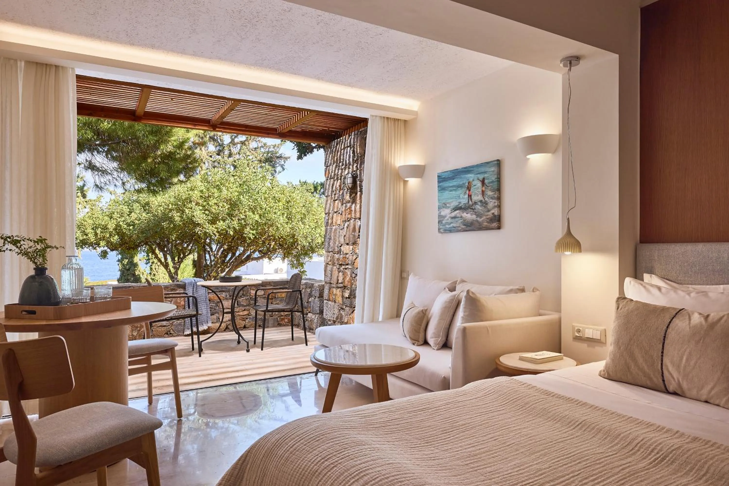 Seating area, Bed in St. Nicolas Bay Resort Hotel & Villas