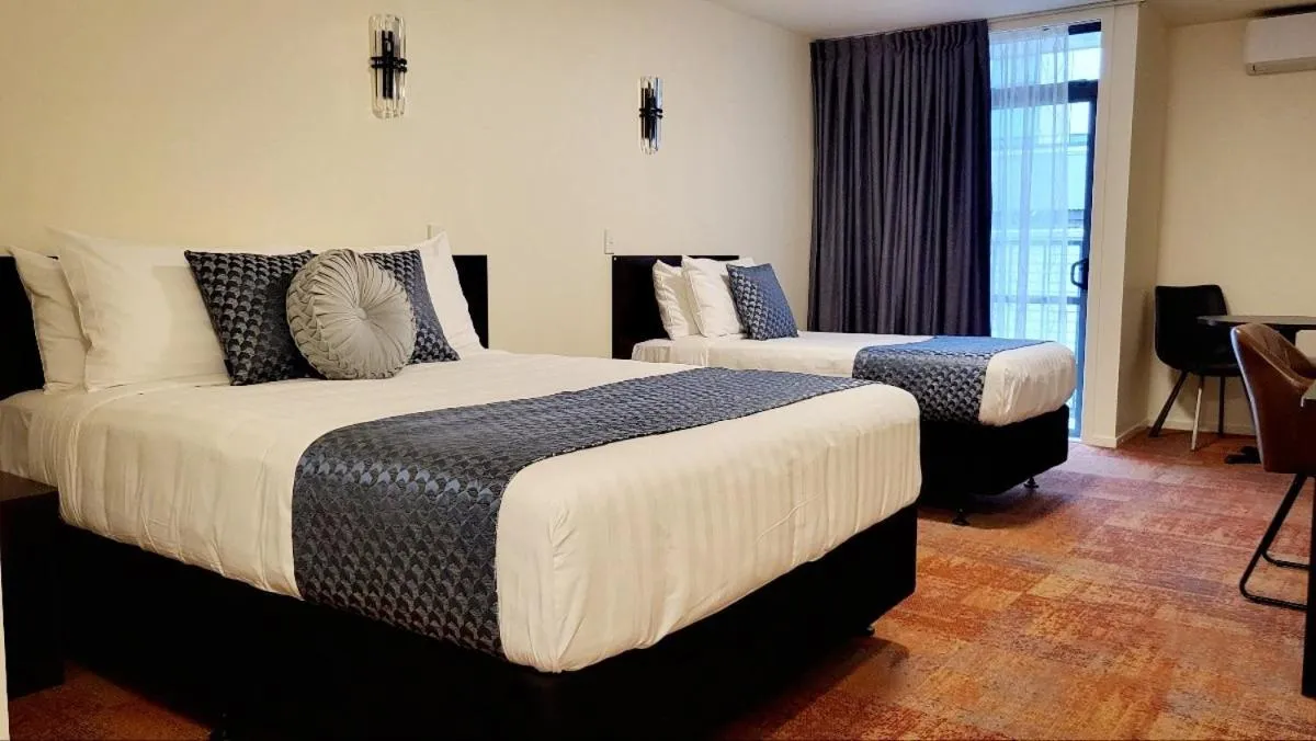 Bed in City of Sails Motel