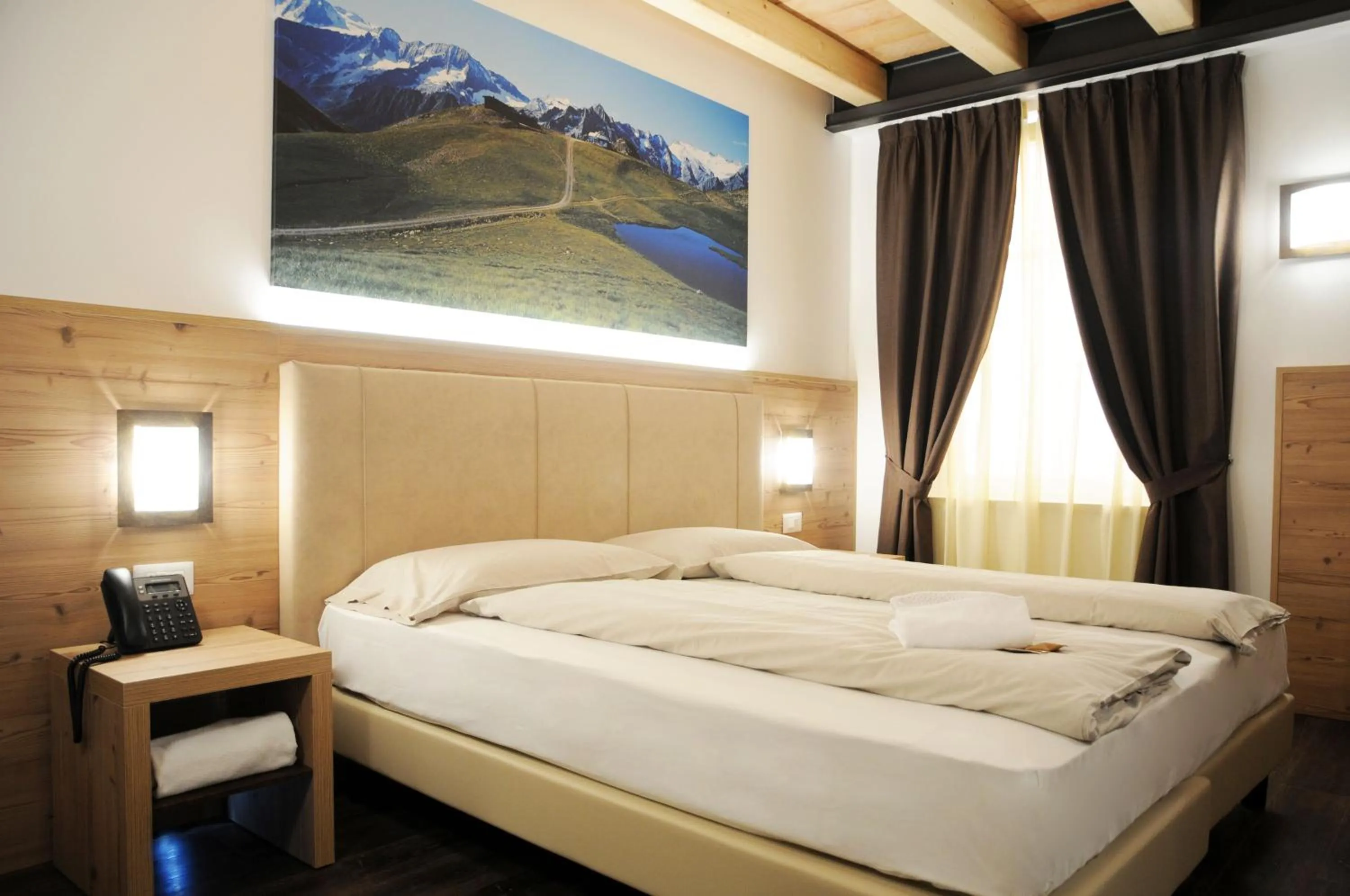 Bed in TOURING HOTEL & SPA