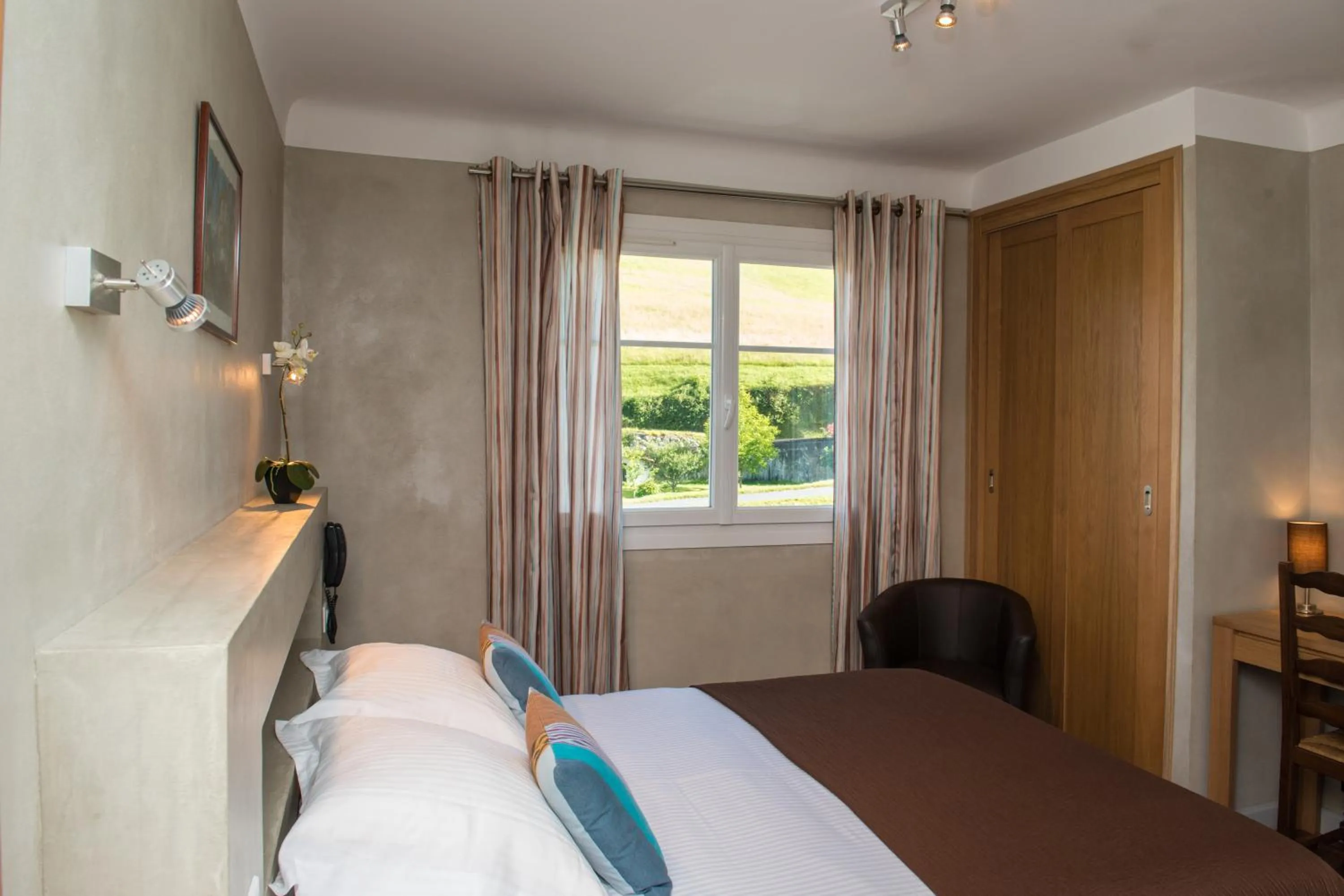 Photo of the whole room, Bed in Logis Hotel Ur-Hegian