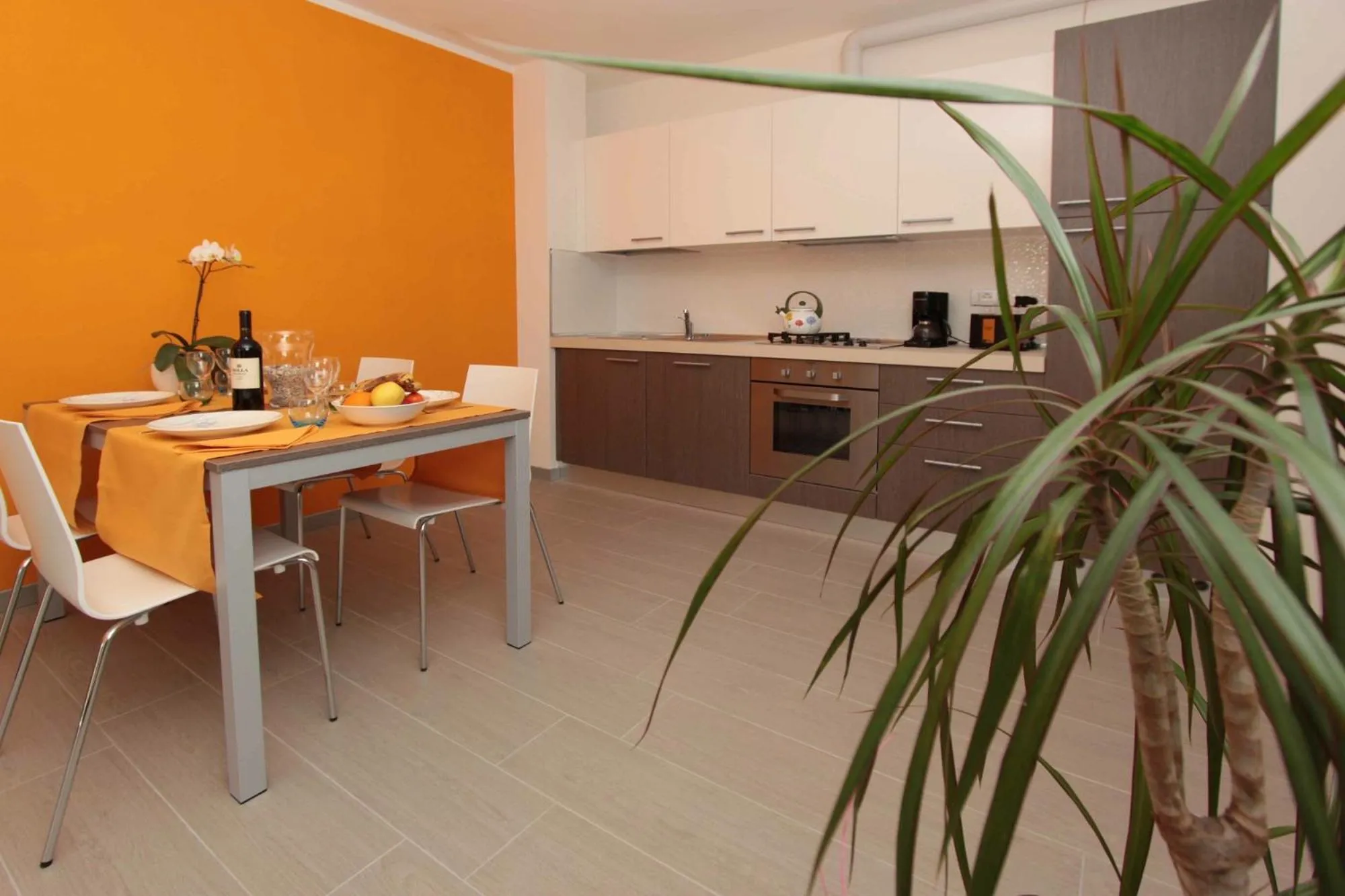 Dining area in Residence Rivachiara (check-in at Hotel Riviera in Viale Rovereto, 95)
