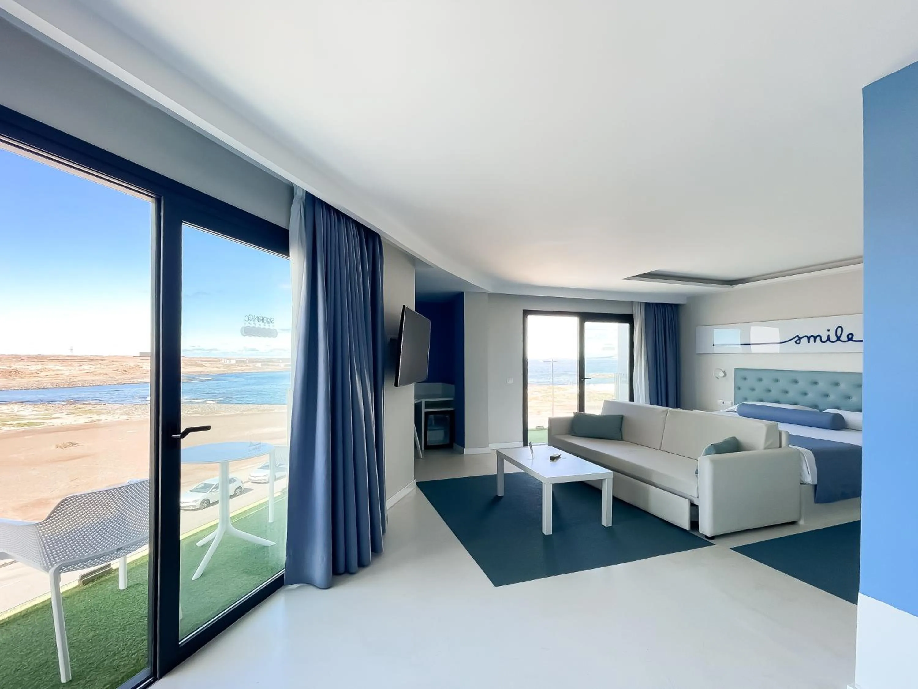 Photo of the whole room, Bed in Corralejo Surfing Colors Hotel&Apartments