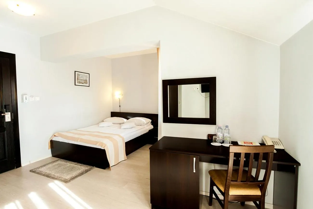 Bed in Astoria Hotel & Restaurant