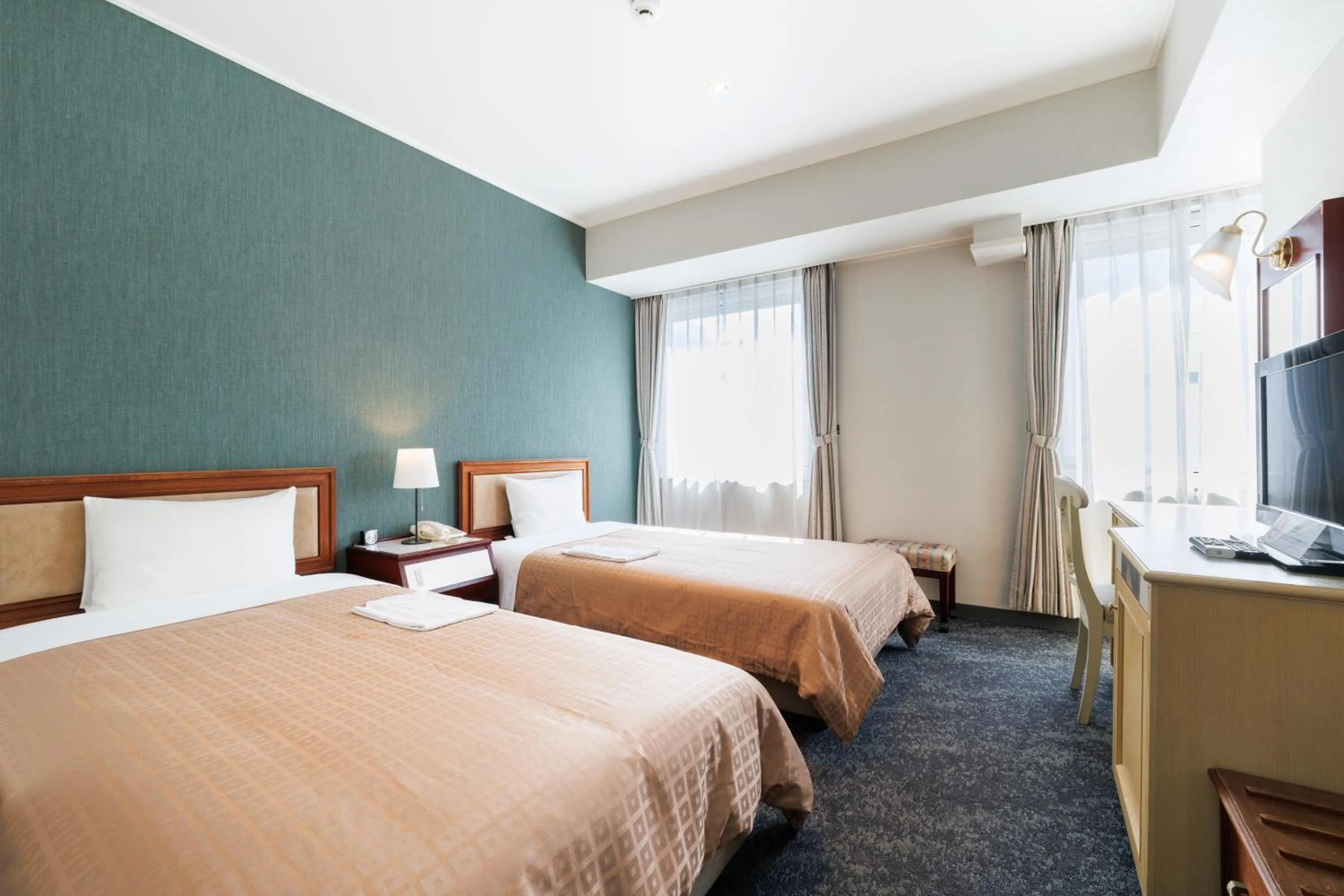 Bed in Hiroshima Intelligent Hotel Annex