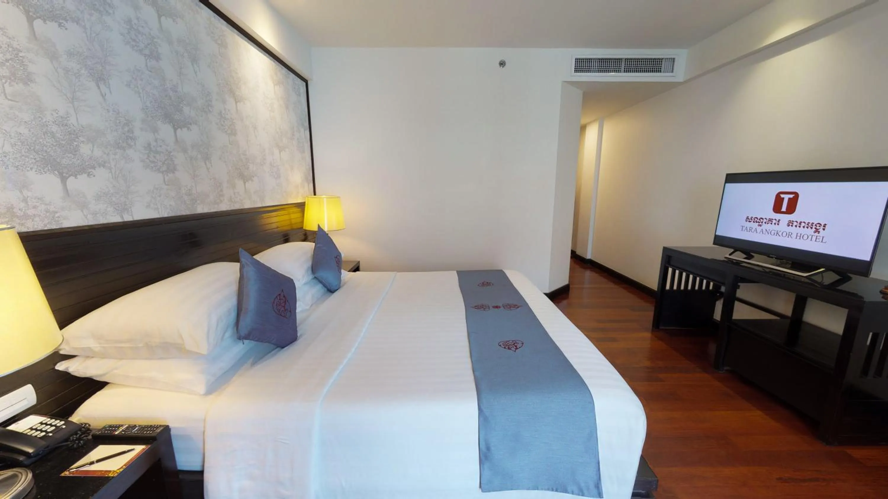 Bed in Tara Angkor Hotel