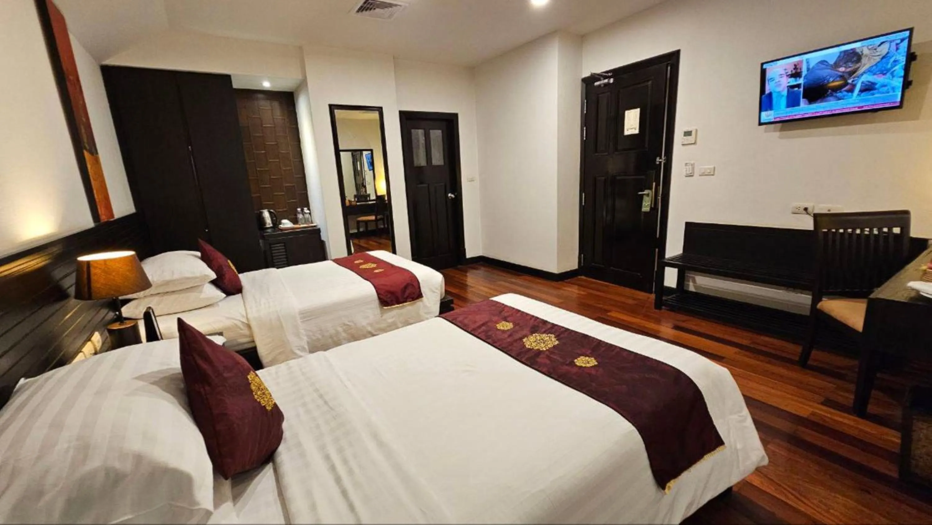 Bed in Tara Angkor Hotel