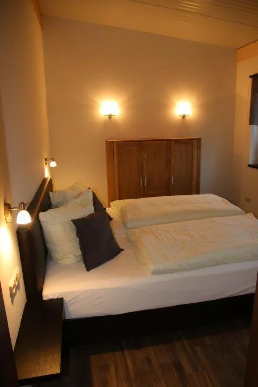 Bed in Kaiser´s Weinland Hotel