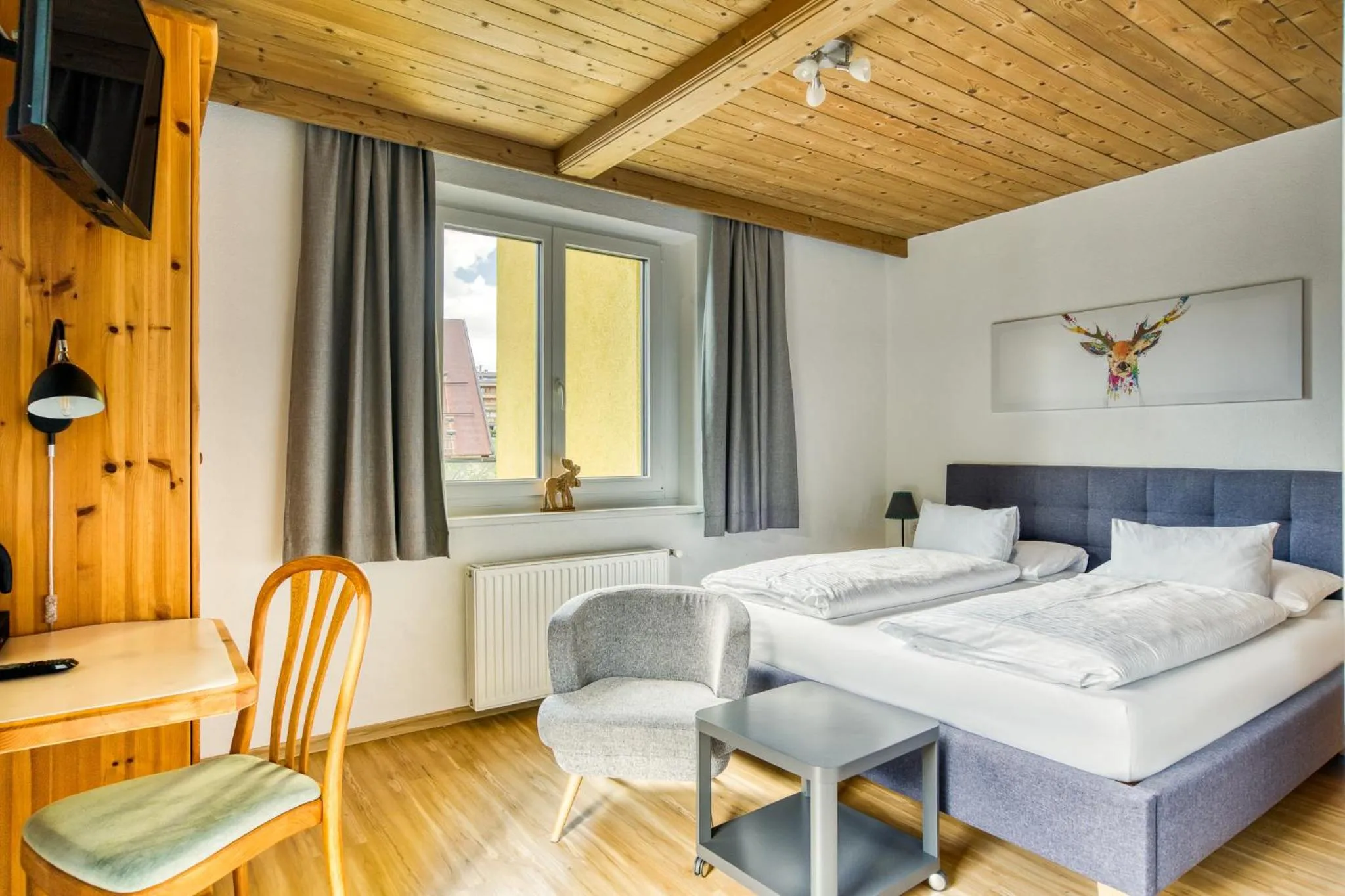 Photo of the whole room, Bed in Boutiquehotel ZOMM in Seefeld
