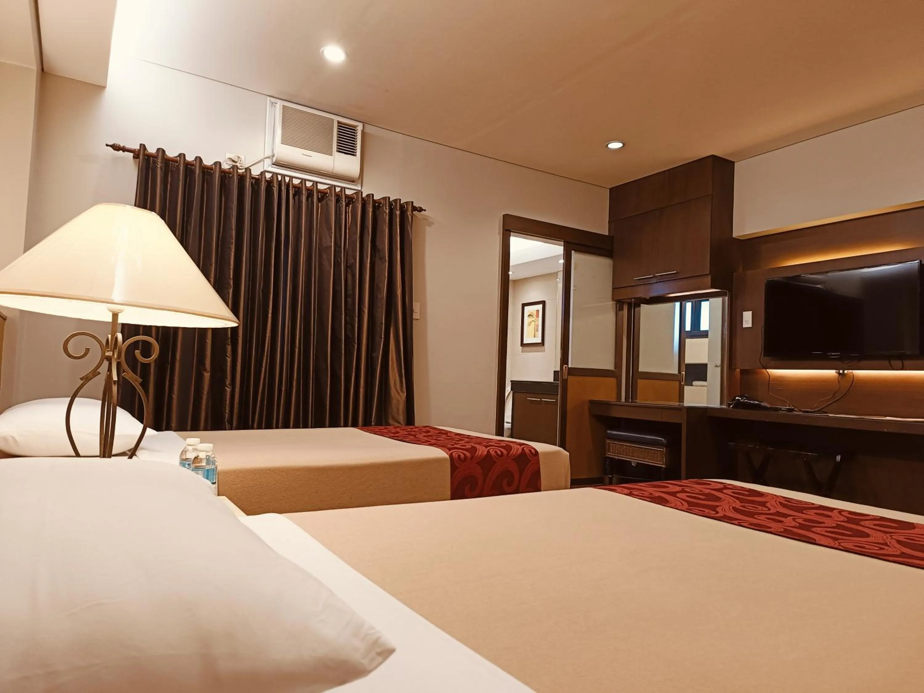 Bed in Tropicana Suites