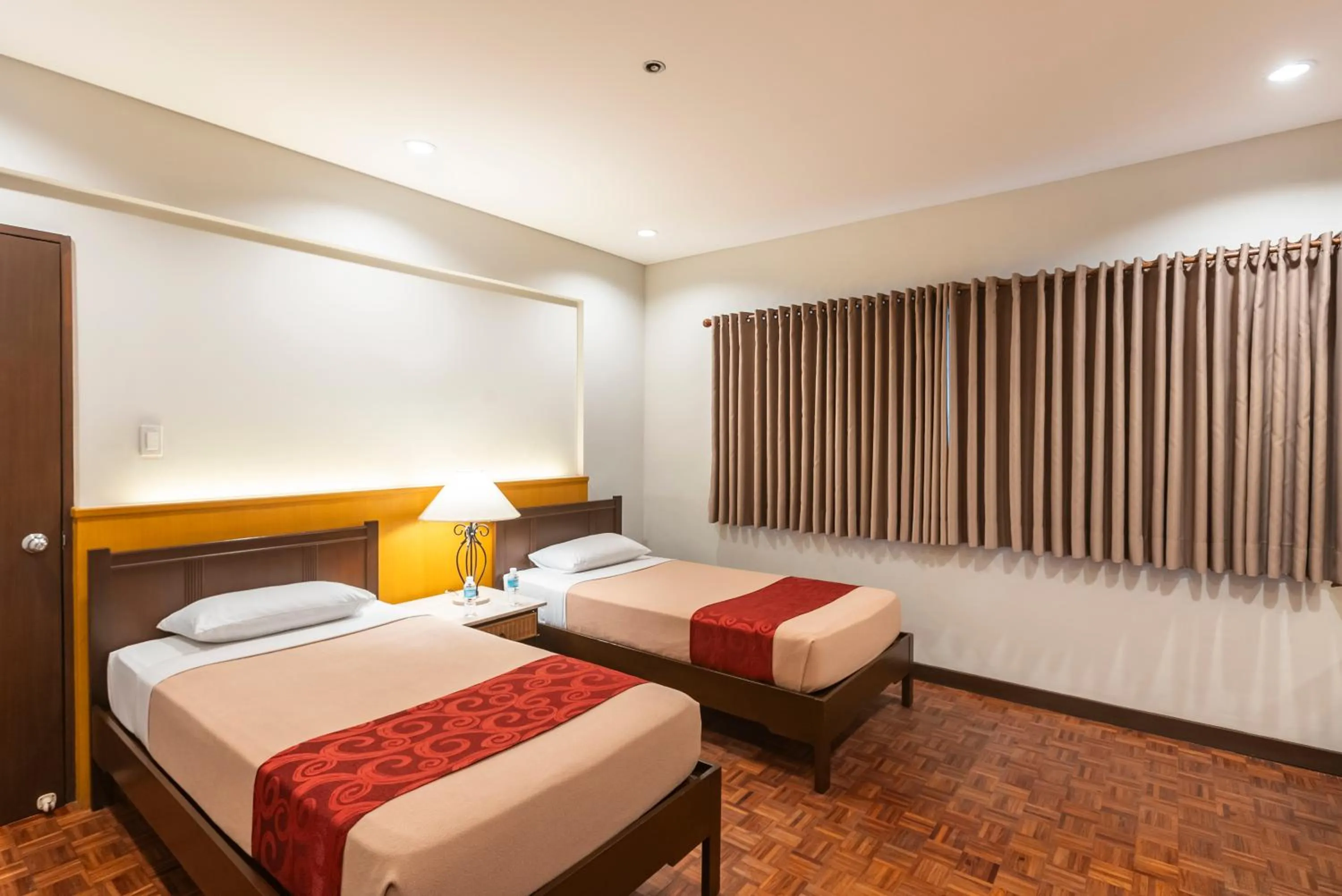 Bed in Tropicana Suites