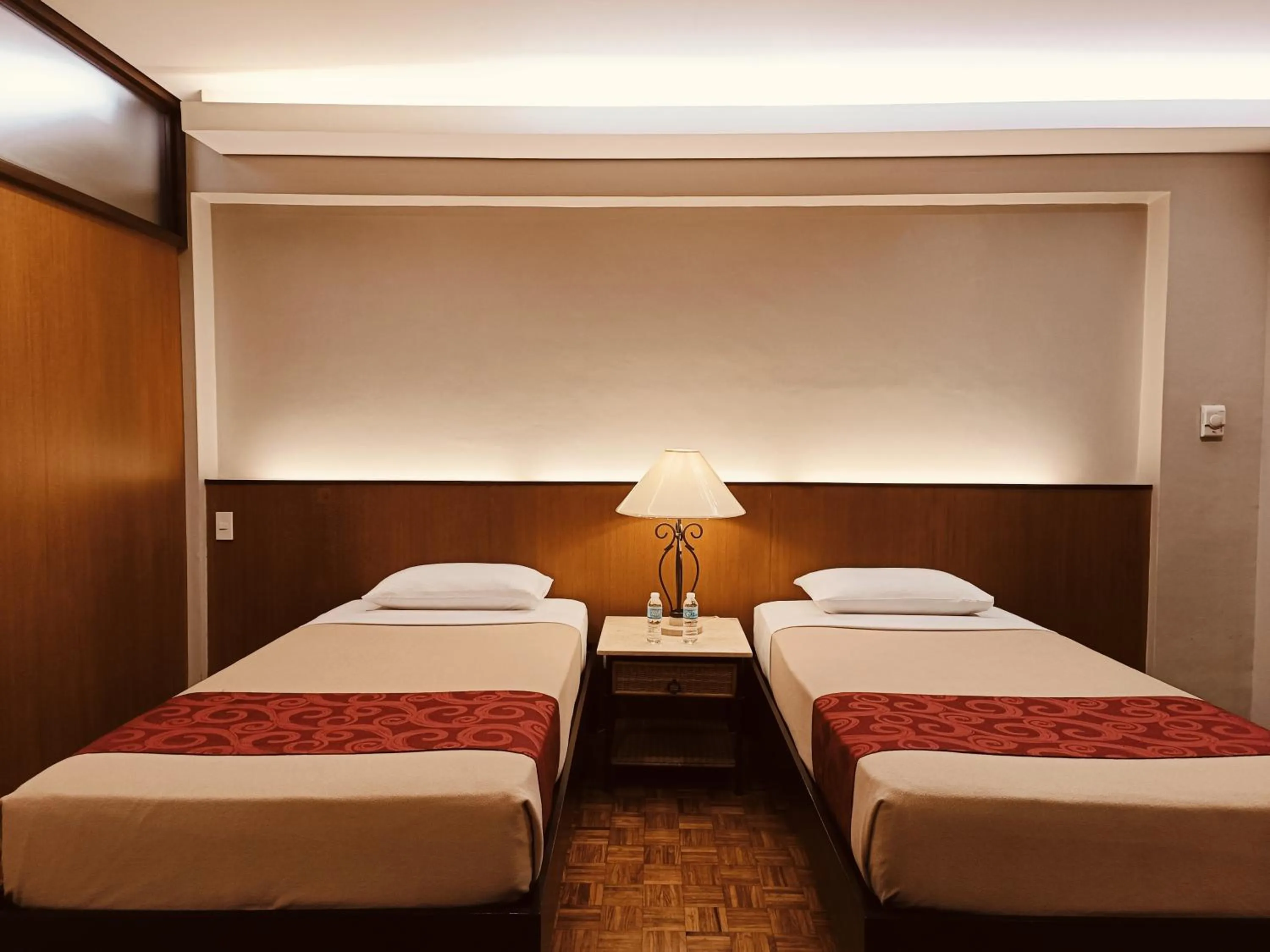 Bed in Tropicana Suites