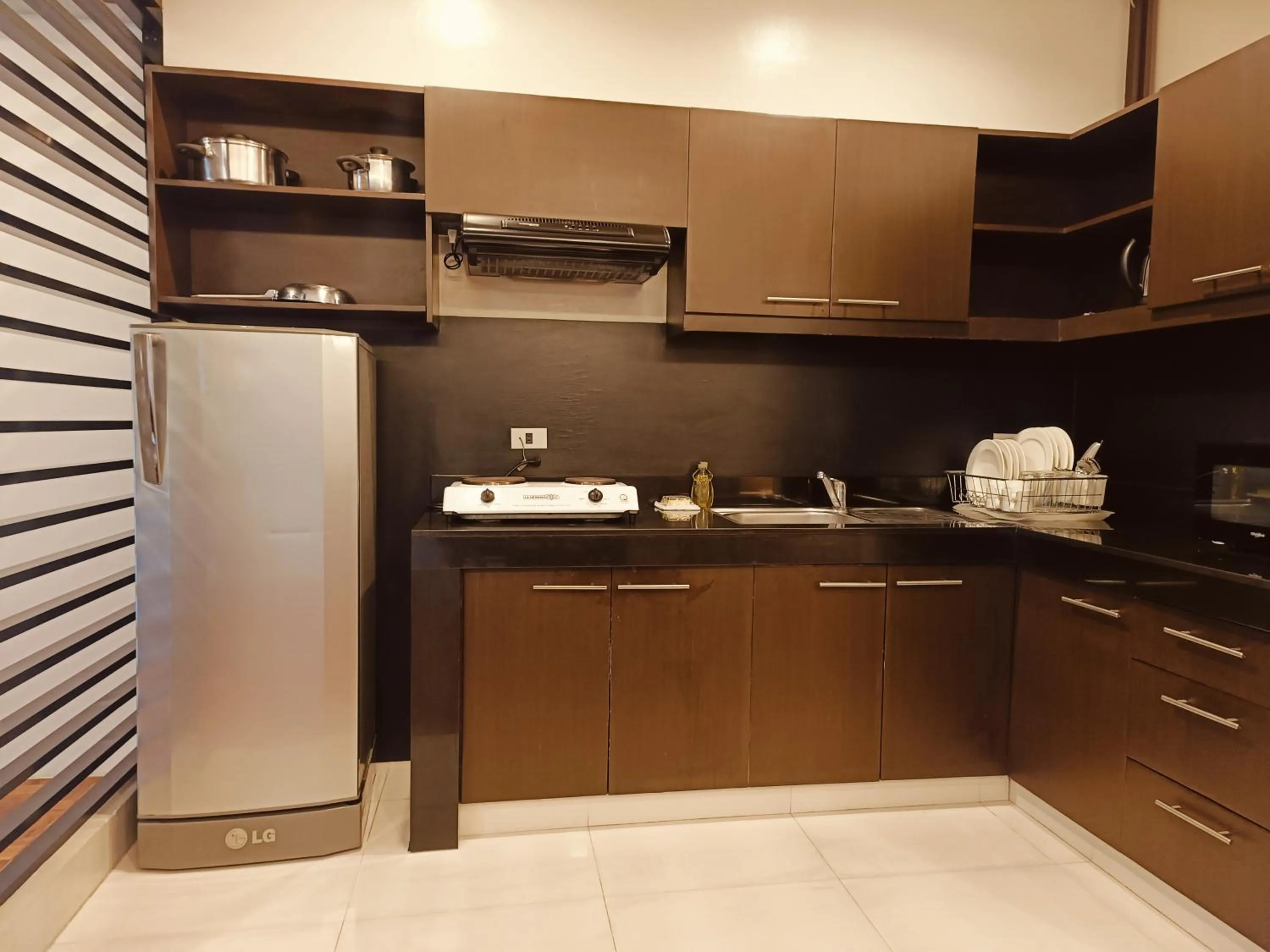 Kitchen or kitchenette in Tropicana Suites