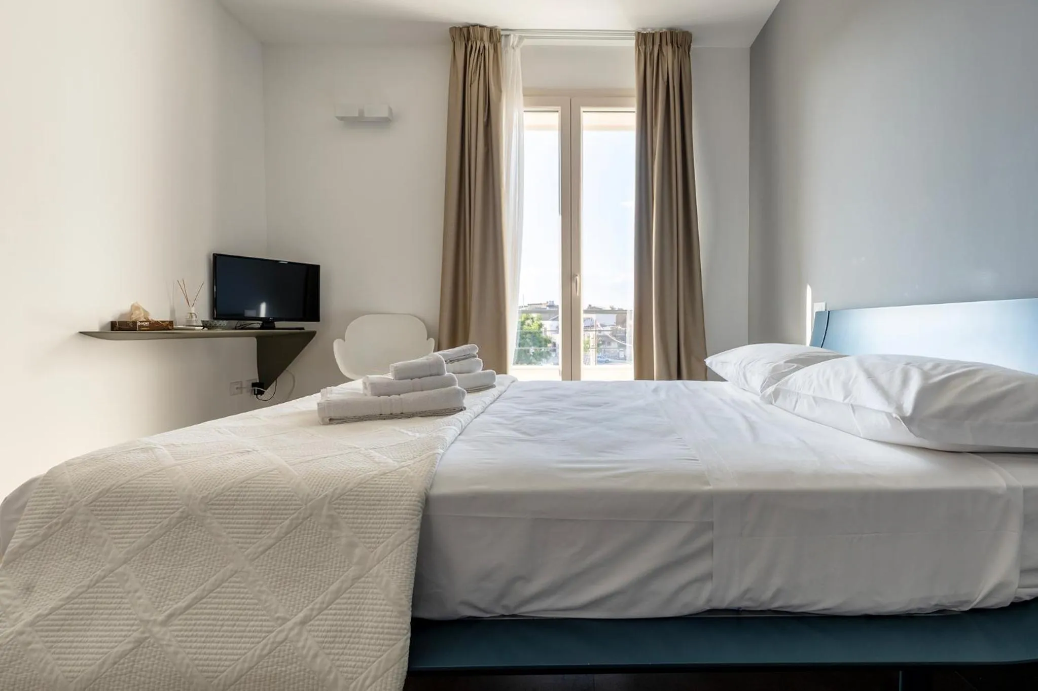 Bed in Serafini Rooms