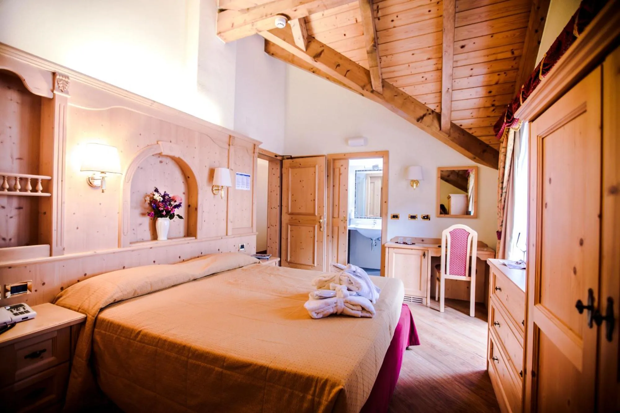 Photo of the whole room, Bed in Albergo Dimaro Wellness Hotel