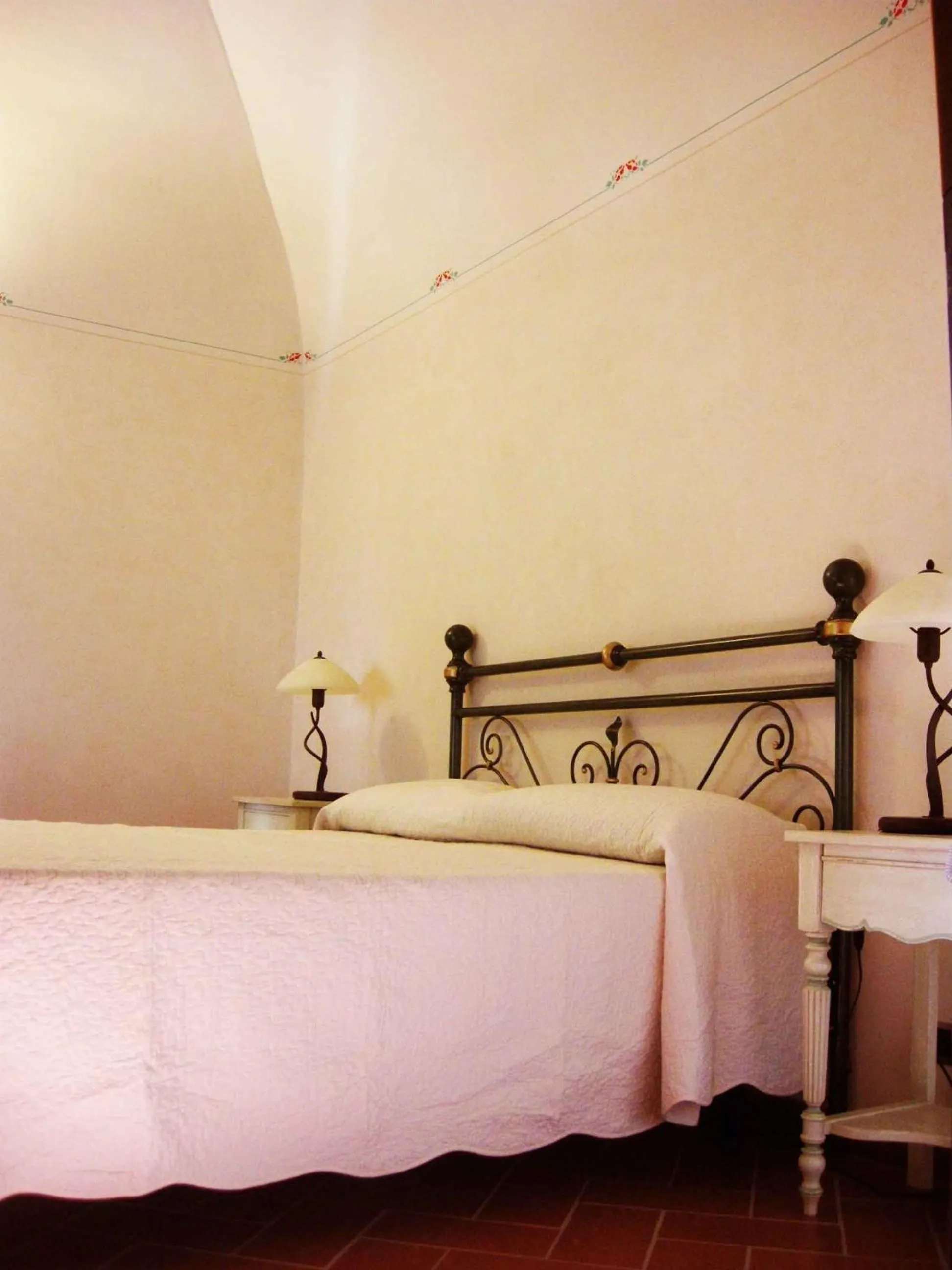 Bed in Relais Villa Sensano