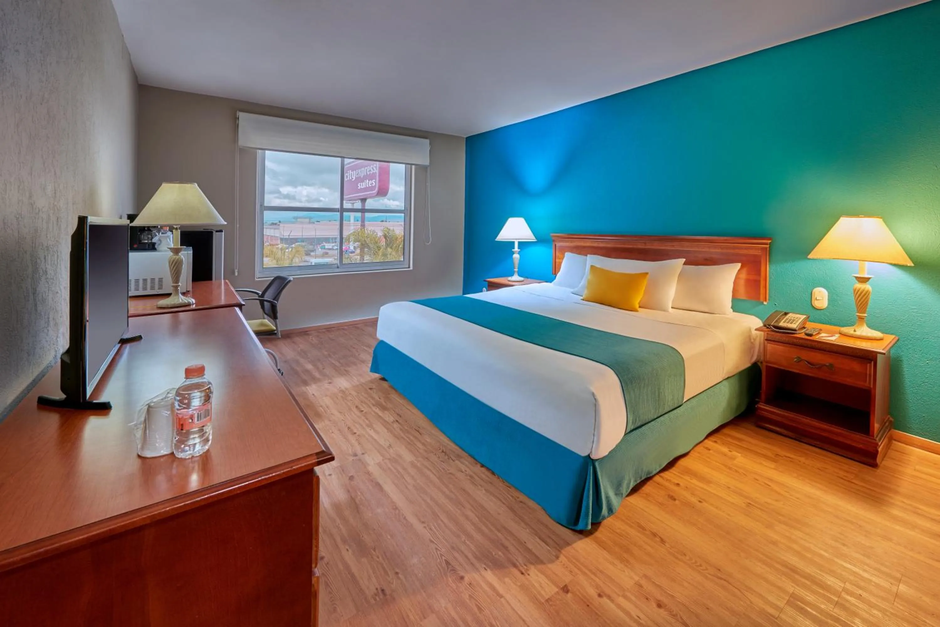 Photo of the whole room, Bed in Sierra Suites By HP Hotels