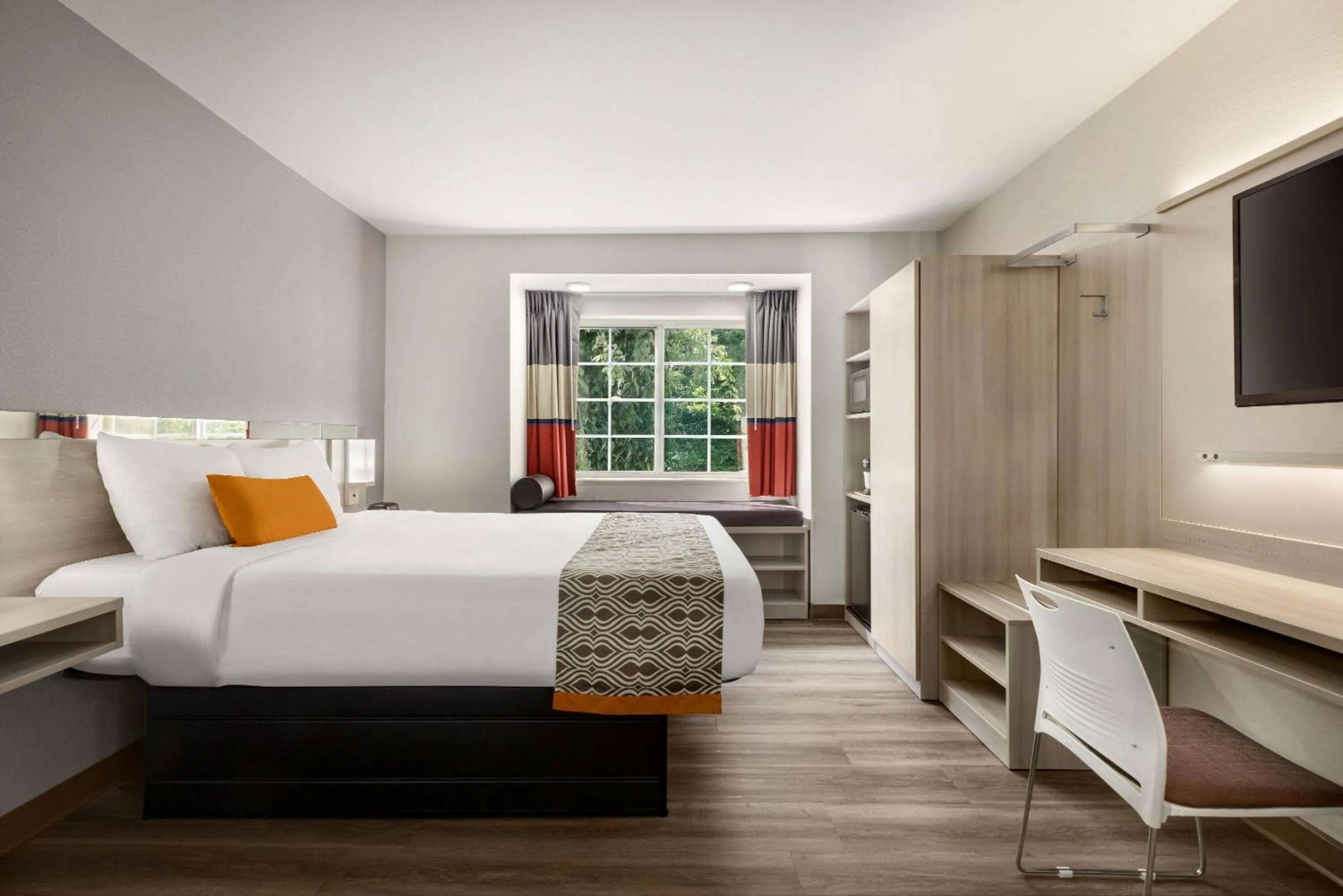 Bed in Microtel Inn & Suites by Wyndham Raleigh