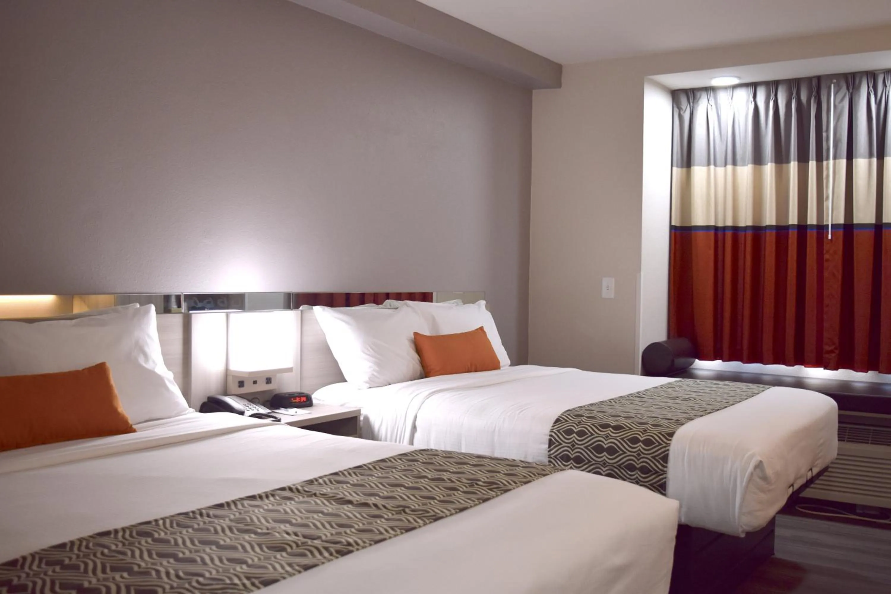 Bed in Microtel Inn & Suites by Wyndham Raleigh