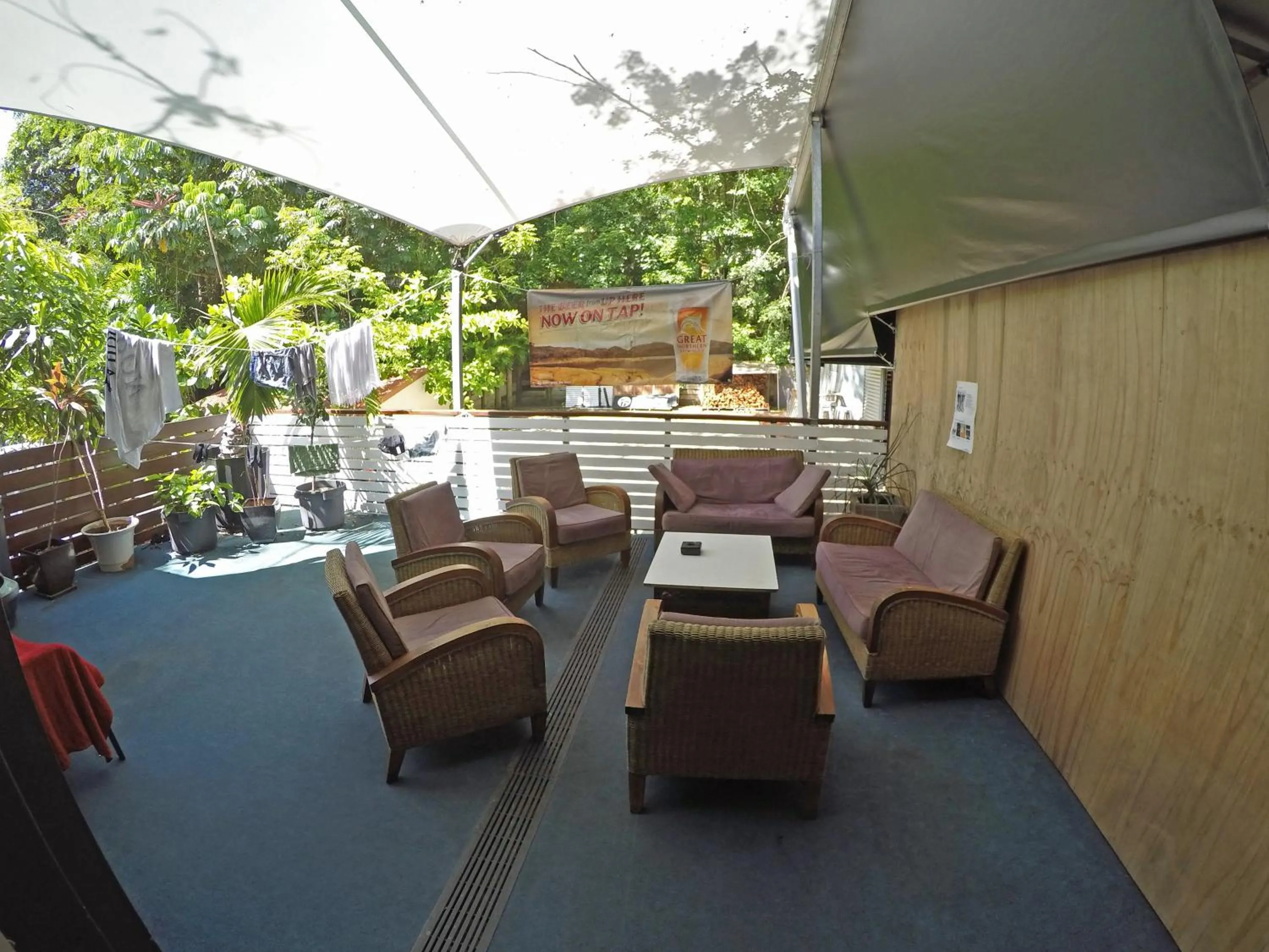 Communal lounge/ TV room in Global Backpackers Port Douglas